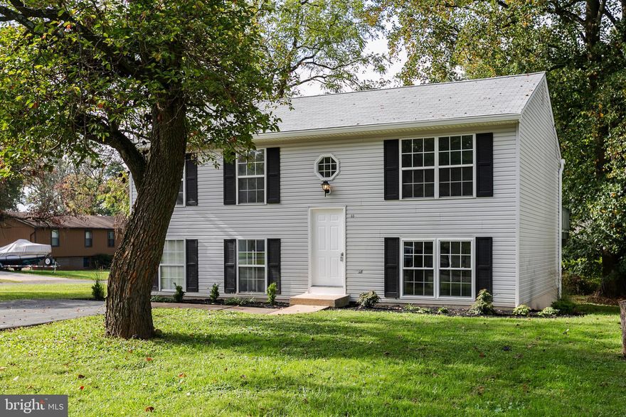 Look no Further!!  Beautiful Remodeled home ready for you to move into.  Open Kitchen with Breakfast Bar overlooking Dining, Family Room and Deck.  2 Bedrooms upstairs with Renovated Bathroom and LVF floors throughout.  Huge Master Suite on Lower level with additional Bedroom and living space.  New Roof, NEW HVAC, Sliding Doors and appliances throughout.  Plenty of storage on lower level and hookups for Washer/Dryer.  Upper level has a Great Deck large enough for all your gatherings and Storage Shed on beautifully flat yard.  Walking Distance to Train Station, conveniently close to The Plaza, Liberty Rd and all Highways.  Don't wait, as this one wont last!