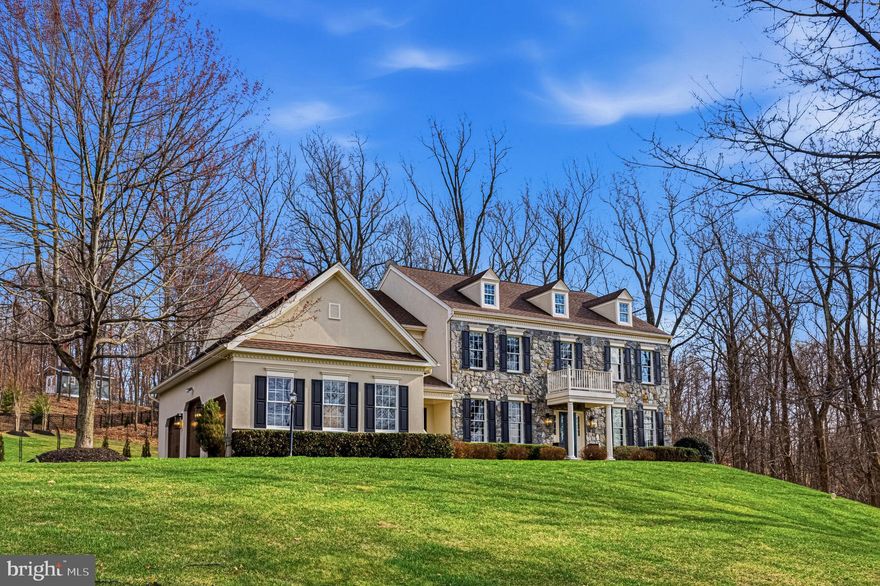 Gracefully sited on what is arguably the most desirable lots in Waterford Ridge, this distinguished stone and stucco residence captures the essence of elevated country living — private, polished, and profoundly inviting. Tucked at the end of a quiet cul-de-sac and set on 3 beautifully landscaped acres, the property offers more than 4,596 square feet of impeccably reimagined living space, where every finish has been thoughtfully selected and every room artfully refined.

A sense of understated grandeur unfolds from the moment of entry, where a sweeping curved staircase with hand-forged iron balusters rises beneath soaring ceilings. Throughout the home, extensive enhancements speak to a commitment to quality and design: richly updated flooring, elegant moldings, curated lighting, fresh designer paint, and beautifully renovated baths and service spaces create a residence that feels both timeless and entirely renewed.

The kitchen is exceptional in both form and function — a true gathering space appointed with premium appliances, upgraded countertops, an oversized center island, and a custom built-in bar designed for effortless entertaining. Even the laundry room has been elevated with bespoke detail, reflecting the home’s consistent level of finish and craftsmanship.

Formal rooms are bathed in natural light and framed by sweeping mountain vistas, lending an extraordinary backdrop to everyday living. The great room is anchored by a striking wood-burning fireplace with an upgraded mantel and stone surround, while a handsome private study, lined with custom built-in cabinetry, offers a quiet and sophisticated retreat.

Upstairs, the primary suite is a sanctuary of comfort and scale, serene sitting area, spa-like bath, and dual walk-in closets. Each secondary bedroom is generously proportioned and complemented by its own exquisitely renovated ensuite bath, offering both luxury and privacy.

Outdoors, the home transitions seamlessly into its resort-like surroundings, where a custom covered deck, expansive rear patio, and welcoming front terrace are enveloped by professional hardscaping, landscape lighting, and mature plantings. A three-car side-load garage completes the offering.

Rarely does a home so successfully unite refinement, warmth, and a fully realized sense of place. This is one of Waterford Ridge’s most compelling offerings — an estate of remarkable beauty, substance, and serenity.