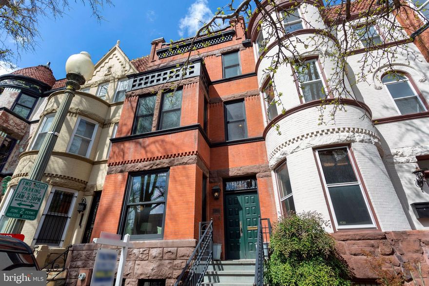 MUST SEE! AN EXTRAORDINARY OFFERING! This elegant, well-proportioned historic brownstone was built in the 1890's by the renowned architect, T. Franklin Schneider (architect of the historic Cairo).  

This home has been meticulously renovated, and maintains significant architectural details including original hardwood floors, 6 beautiful fireplaces and spectacular leaded glass.

TOTAL SQUARE FOOTAGE INCLUDING FINISHED LOWER LEVEL 3,444 SQUARE FEET!!

FIRST FLOOR:

The foyer opens to a large living room with beautiful bay front windows flooded with southern light.  A large separate formal dining room is perfect for large functions or intimate dining.  The gourmet kitchen features Wolf, Sub Zero and Bosch appliances, wall-to-ceiling custom cabinets and breakfast nook. A convenient half-bath completes the floor.  The rear exit takes you to the secure oversized garage with ample storage, and a spacious garage roof-top deck is perfect for outdoor entertaining friends and family!

SECOND FLOOR:

There are two complete formal guest suites with private en-suite baths, and a central media room/library, with its own wet bar and refrigerator. Tons of storage!!

THIRD FLOOR:

The spectacular owner's suite fills the entire floor, with a beautiful clerestory vaulted ceiling and two private decks.  A conveniently located full washer and dryer are right here. The suite includes a wet bar and refrigerator.  The custom closets are huge, and the bath will be your own private spa! 

LOWER LEVEL:

A huge fully finished one bedroom, one bath inlaw suite with its own washer and dryer and full kitchen.  

Riggs Place is ideally located, "the prettiest block in Dupont Circle," and blocks from the 14th Street Corridor. Easy walks to the Metro, Whole Foods, Trader Joes, VIDA and great cafes, restaurants, theater and museums.  Just a few blocks to the White House!

OPEN  SUNDAY APRIL 3rd  1-4.