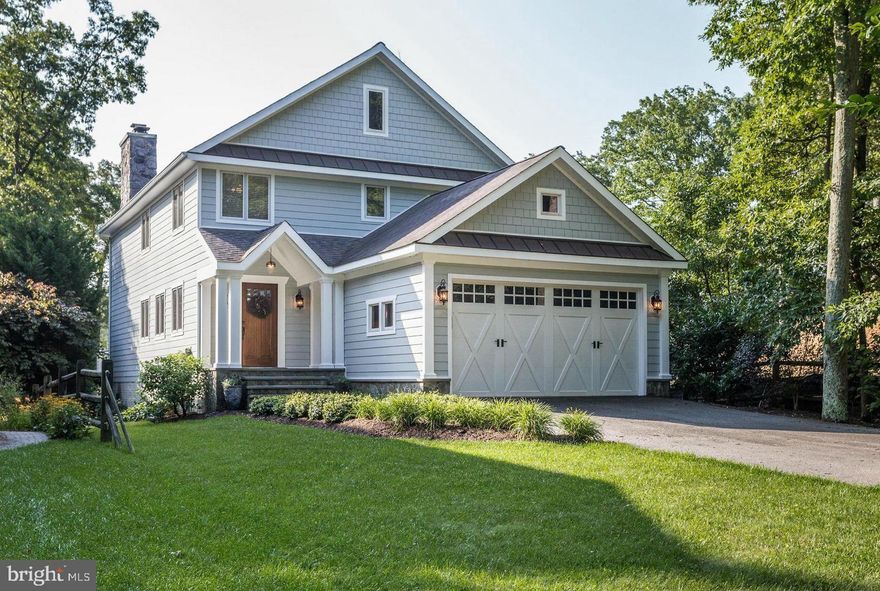 WATERFRONT LUXURY WITH WATER DOCK & RESORT-STYLE POOL
Set sail from your backyard at this extraordinary Craftsman home on Cattail Creek, just minutes from the open waters of the Magothy River and Chesapeake Bay beyond. With a private water dock ready for multiple boats and jet skis, this is a true boater’s dream—whether you're heading out for an early morning fishing run or a sunset cruise.
THE ULTIMATE BACKYARD ESCAPE
Designed for those who crave waterfront leisure, this home boasts a show-stopping pool and spa by Town Creek that rivals luxury resorts. Surrounded by exquisite flagstone hardscaping, custom stone walls, and lush landscaping, the pool area is perfectly positioned to take in uninterrupted water views. Lounge, entertain, or unwind—all while the creek shimmers in the background.
PANORAMIC VIEWS & BREEZY OPEN PLAN
Inside, you'll find a soaring two-story great room wrapped in glass and anchored by a grand stone fireplace, bringing the outdoors in and making the water the star of every gathering. French sliders open to a waterside deck ideal for dining alfresco after docking in for the evening.
 FUNCTIONAL LUXURY LIVING
The lower-level walk-out offers bonus spaces for relaxing or working remotely, with full water views and access to a separate office, full bath, and storage. The main level includes a generous kitchen, a mudroom off the garage, a bedroom, and an open-flow foyer with built-ins. Upstairs, the waterfront-facing primary suite includes a spa-style bath and commanding views over the creek.
 SEVERNA PARK’S BEST KEPT SECRET
Located in one of Severna Park's most desirable waterfront communities, this home blends laid-back luxury with top-tier convenience. From paddleboarding off your dock to entertaining by the pool, every day here feels like vacation.
 Dock. Dip. Dine. Repeat   in this exceptional waterfront oasis.