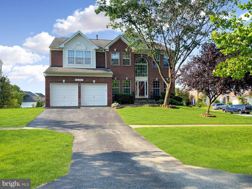 Beautifully Updated brick front colonial home sits on a premium corner lot in sought-after Kings Crossing community. ​Move in Ready, freshly painted with beautiful neutral colors,  brand new hardwood flooring on the main level, brand new carpet upstairs. New roof &  new gutter (2024), New water heater (2024), refrigerator (2021), Washer and Dryer (2022), Dishwasher (2022), Sump pump (2023). Great floorplan offers what you are looking for: Inviting 2-story foyer entrance; main level home office; beautiful living room & elegant formal dining room; Family room w/stacked stone gas fireplace widely opens to renovated gourmet kitchen, featuring beautiful granite countertops, custom designed cabinets, nice upgraded stainless steel appliances, Convenient main level laundry room. A large maintenance free deck right off the kitchen perfect for relaxing or entertaining. Upstairs has 5 bedrooms 2 full bathrooms; Spacious Master bedroom with large walk-in closet, master bathroom w/soaking tub, separate shower, his and her vanity stations; Newly re-finished Walk-out basement with full size windows; full bathroom, media room, rec room, & walk-out to backyard. ​Luxury vinyl plank flooring in the basement. Sought-after location, walking distance to 2 local parks, minutes from the South Germantown Recreation Complex offering over 20 soccer fields, Adventure Playground, a driving range, archery range, the Discovery Zone indoor athletic complex, the Germantown Indoor Swim Center, indoor and outdoor tennis, mini-golf, splash park, miles of hiking and biking trails and so much more. Easy access to I-270, MARC Train, Shady Grove Metro, and numerous shopping, dining, and entertainment centers. Available for immediate move in.