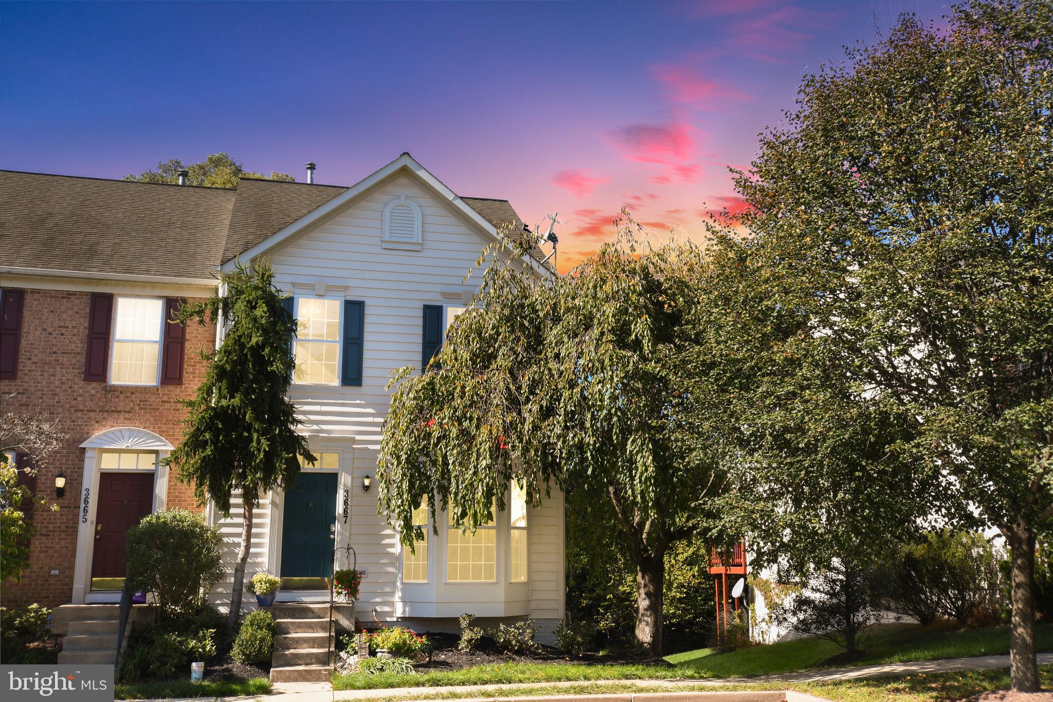 This fantastic Villages of Urbana townhouse is situated in a great location--just steps from playgrounds, and a quick walk to schools and the Urbana Market District--with its restaurants, grocery, shops and library. This light-filled end unit (with plenty of windows) is a relaxing oasis. Backing to privacy, the tree-lined lot makes a great space for enjoying the spacious deck. Enjoy your morning coffee on the deck and enjoy the serenity. Freshly painted throughout in neutral tones, this home is move-in ready! The main level features gleaming hardwoods, a bay window in the living area and an open concept--perfect for entertaining your guests! The gourmet eat-in kitchen features granite, Stainless steel appliances and a custom backsplash. Gather in the family room--with windows galore, a cozy gas fireplace and great views of the backyard. On the upper level, the large Primary suite features an extra-large walk-in closet and spa-like bath with a separate shower and soaking tub. Plus two more large upper bedrooms and a convenient hall bath. The lower level features another fireplace for enjoying the large living/recreation area. All this, plus a full bath and a bonus room--perfect for a guest room, craft room or work-out room. Walk out from the lower level to the serene back area. All this--plus the fantastic Urbana schools, and this home is conveniently located in a great commuter location! This lovely home won't last long!