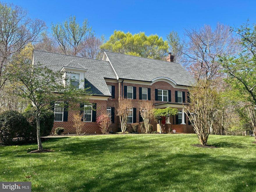 Discover the perfect blend of space and privacy in this stately, 4,000+ sqft. Colonial, situated on a sprawling 1.97-acre lot. A classic brick walkway leads you past the manicured lawn to a welcoming covered front porch. Inside, the main level impresses with gleaming hardwoods throughout the formal living and dining rooms. The heart of the home is the bright, airy kitchen, finished with tile flooring, ample cabinetry, and a built-in peninsula offering bar stool seating. Just off the kitchen, a versatile bonus room serves as a dedicated home office or an expansive walk-in pantry. Relax in the spacious, carpeted gathering room with fireplace or step outside to the private rear patio, perfect for quiet mornings or summer entertaining overlooking your vast backyard. Upstairs, the primary suite is a true sanctuary, boasting vaulted ceilings, a spa-like bath, and three large walk-in closets. To complete the upper level, a hall bathroom with tub/shower combo plus a dual sink vanity and three additional decent sized bedrooms with nice closet space. The unfinished basement offers endless potential for future equity, already roughed in for a full bath. With a two-car garage and an unbeatable location easily within commuting distance to DC/Northern Virginia. This home feels tucked away yet remains a short drive from major shopping and dining.