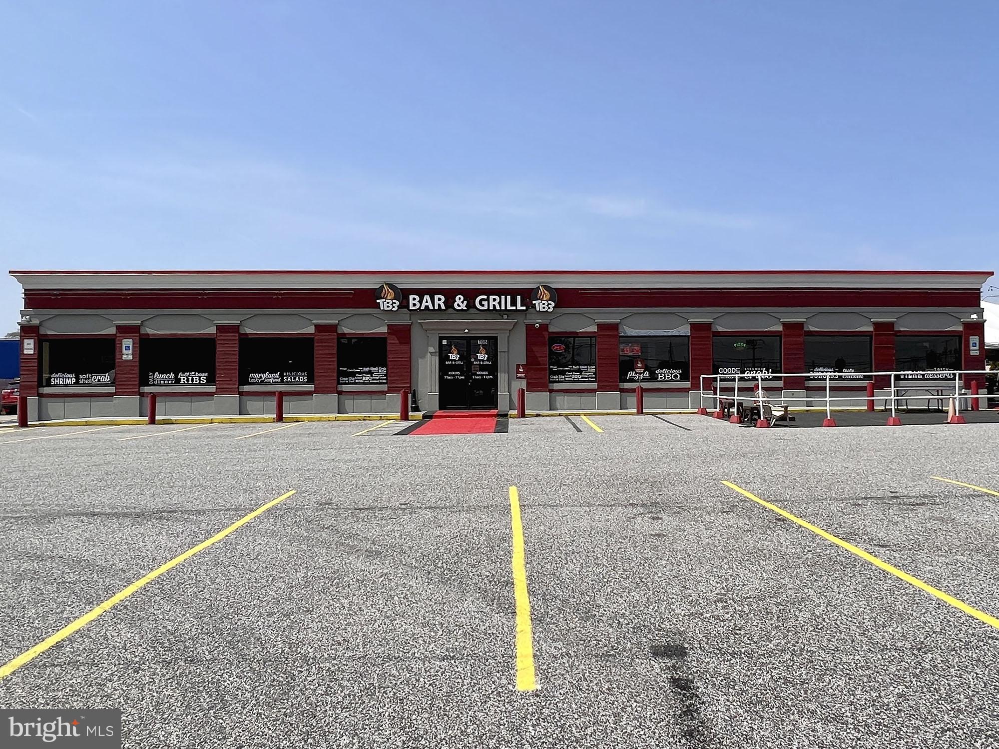 REAL ESTATE AUCTION featuring ON SITE and SIMULCAST ONLINE BIDDING!! Online Bidding Opens - Monday, June 19, 2023. Live On Site Auction - Wednesday, June 21, 2023 at 11:00 AM. List price is opening bid only. $60,000+ NNN Annual Income.
705 S. Philadelphia Boulevard, currently known as TB3 Bar and Grill, is located at the corner of Philadelphia Boulevard (US-40) and Old Philadelphia Road in the heart of Aberdeen. Philadelphia Boulevard, known as Pulaski Highway through most of the span between Baltimore and Wilmington, is a major artery across the United States.
The site is comprised of two lots providing a triangle shaped property with substantial exposure and frontage along both Philadelphia Boulevard (US-40) and Old Philadelphia Road. Ample parking, signage and a functional amount of building square footage make the property ideal for entrepreneurs looking to open their own retail location, as well as those investors looking to continue operating the property as a cash-flow asset. The built-in consumer base provided by the expansive number of people working and residing in the immediate area, and further reinforced by the very healthy traffic counts among those passing through, makes the acquisition an attractive retail real estate opportunity for all buyers. The property’s location within a Federally designated Opportunity Zone, providing an array of financial incentives for development, is an additional bonus.
