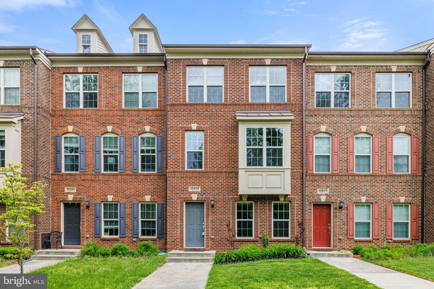 Impeccable brick townhome in the idyllic and desirable Villages of Piedmont. Enjoy luxury living in this home with hardwood floors, spacious rooms, and natural light flooding in through the windows. Step into the foyer and you will be greeted by a cozy den, the perfect space for a media room, home office, and more. Easy access to the oversized, two-car garage. On the main level, you'll be met with a bright and inviting open floor plan, complete with a formal dining area, relaxing living room with bay windows and views of lush green trees. Your new gourmet kitchen is a chef's dream with stainless steel appliances, gleaming granite countertops, dark oak cabinetry, large center island, and tile backsplash. Plenty of space for a breakfast area or cozy family room. Head upstairs to take in the sumptuous master suite with a walk-in closet and ensuite bath boasting a dual sink vanity and soaking tub. Two more generous bedrooms with cathedral ceilings and a full bath are located on the upper level, in addition to the hall laundry room. This amenity-rich community offers 7 miles of trails within the 380 acres of nature preserve, 2 pools, 2 clubhouses, a dog park, multiple tot lots, catch & release fishing pond, basketball, tennis, and volleyball courts! Close to historic Haymarket, Gainesville, I-66, and commuter lots. Don't miss out - this beautiful home is a must-see!
