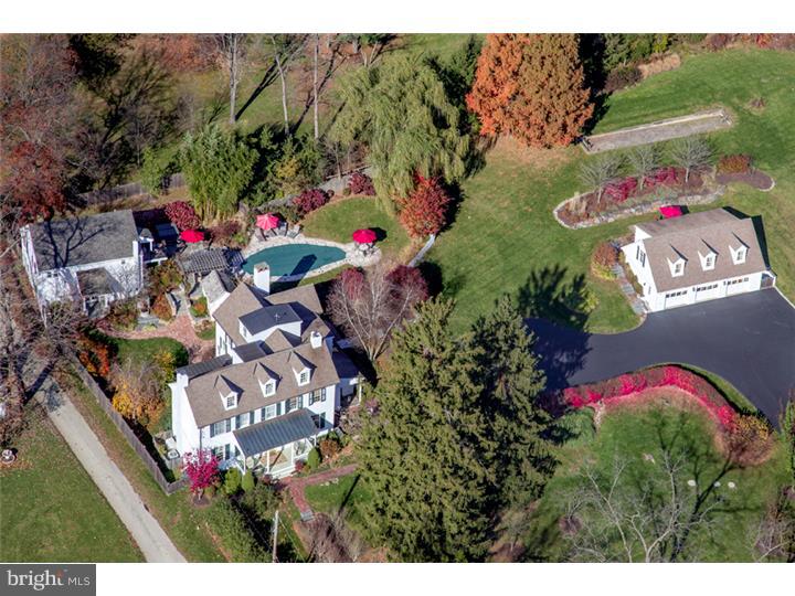 Quintessential Chester County Family Compound. Enjoy residential bliss in the Chester County countryside on 2.38 acres of park-like grounds graced by pristine landscaping, specimen plantings, a custom water feature, magical walks and stone walls, a swimming pool, hot tub, outdoor kitchen, Bocce court and spring house. This meticulously-maintained Chester County family compound is the ultimate private retreat with a completely renovated 5 Bedroom, 3 and 3-half bath historic Farmhouse, charming Guest Cottage with a home office and bedroom suite, restored Barn with 2 Bedroom apartment, stunning recreation/media room and kitchen. The light-filled main residence exudes elegance, with a modern open floor plan rarely found in an older Farmhouse. Over-sized windows, beautiful fireplaces, built-ins, wide-plank hardwood floors, baseboard/crown moldings, bead board and other tasteful details extend throughout the home. The sprawling 5.643 square foot interior welcomes comfortable living or entertaining with a gracious living room, dining room with terrace access, gourmet kitchen with center island, custom cabinetry, soapstone counters and premium stainless appliances, breakfast room with skylights, spacious family room, master suite with vaulted ceiling and Juliet balcony, walk-in closet and spa-like bath, laundry room and more.
