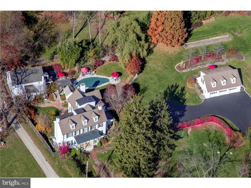 Quintessential Chester County Family Compound.  Enjoy residential bliss in the Chester County countryside on 2.38 acres of park-like grounds graced by pristine landscaping, specimen plantings, a custom water feature, magical walks and stone walls, a swimming pool, hot tub, outdoor kitchen, Bocce court and spring house. This meticulously-maintained Chester County family compound is the ultimate private retreat with a completely renovated 5 Bedroom, 3 and 3-half bath historic Farmhouse, charming Guest Cottage with a home office and bedroom suite, restored Barn with 2 Bedroom apartment, stunning recreation/media room and kitchen. The light-filled main residence exudes elegance, with a modern open floor plan rarely found in an older Farmhouse. Over-sized windows, beautiful fireplaces, built-ins, wide-plank hardwood floors, baseboard/crown moldings, bead board and other tasteful details extend throughout the home. The sprawling 5.643 square foot interior welcomes comfortable living or entertaining with a gracious living room, dining room with terrace access, gourmet kitchen with center island, custom cabinetry, soapstone counters and premium stainless appliances, breakfast room with skylights, spacious family room, master suite with vaulted ceiling and Juliet balcony, walk-in closet and spa-like bath, laundry room and more.