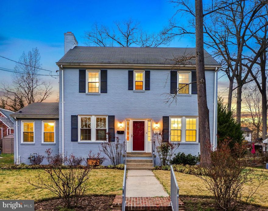 Welcome to 902 Jackson Avenue, a stately and fabulous colonial home featuring fun midcentury accents, all freshly renewed by the current long-term owners for your enjoyment! Situated in the delightful, friendly Between-the-Creeks neighborhood, freshly painted and featuring refinished wood flooring on the main and upper levels, this home offers a pleasant blend of classic charm and modern comforts.

The spacious living room includes a wood burning fireplace and crown molding. Just off the living room is a light-filled sunroom with display shelving and access to the backyard. The formal dining room is detailed with crown and chair rail molding and a brass chandelier. The kitchen offers rich wood cabinetry, a pantry, spoke lighting, and access to the rear synthetic deck. The main level is complete with a powder room and an inviting foyer with a deep coat closet.
Upstairs are three bedrooms with updated overhead lighting and an updated bathroom. The primary bedroom is generously sized and features two walk-in closets, one with fixed stairs leading to a floored attic.
The lower level provides a recreation room with a fireplace, a Jack-and-Jill full bathroom that opens to both the kitchenette and recreation room. The kitchenette enjoys vintage cabinetry, a refrigerator, and access to the backyard. This level also includes a bonus room or guest bedroom with a deep closet and windows.
Outside, the fenced backyard features a deck and complementary landscaping, creating an ideal setting for outdoor gatherings. There is also a farmhouse-style board-and-batten storage shed with space for bikes and tools. The home includes a private driveway.
Enjoy living in eclectic Takoma Park, where the location offers both charm and convenience. The area provides easy access to trails, parks, and playgrounds, as well as shopping, restaurants, and entertainment in Takoma Park and downtown Silver Spring. Located just steps from Sligo Creek Park, the neighborhood is known for its summer block parties, Halloween gatherings, potluck dinners, and gardening events. A short ride to the Red Line Metro adds to the access, and appeal, of this classic home!