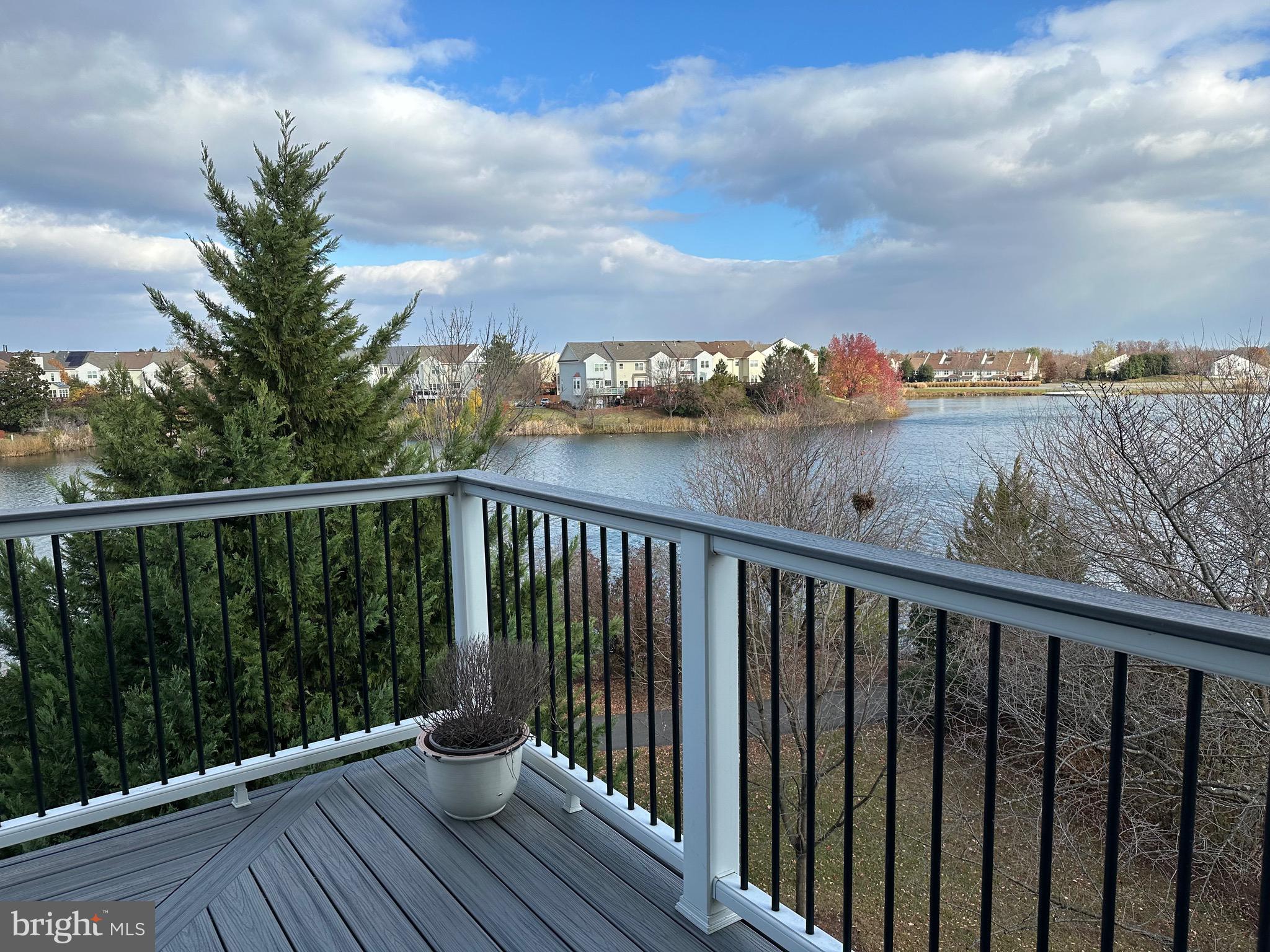 Welcome to your dream penthouse in the heart of Ashburn Village—where luxury living meets lakeside tranquility. This stunning “Tahoe” model offers sweeping views of Pavilion Lake from a rare wrap-around Trex balcony—the perfect spot for morning coffee or evening sunsets. The primary suite features its own private balcony retreat, while the open-concept layout makes every corner feel spacious and bright.
Inside, you’ll find a chef-inspired kitchen with quartz counters, stainless steel appliances, gas cooking, and designer finishes that will make entertaining a joy. The living room’s cozy fireplace creates the perfect backdrop for relaxing nights in. Two bedrooms and two spa-like bathrooms provide both comfort and style, and a convenient ground-level storage unit adds extra space.
Living in Ashburn Village means more than just a home—it’s a lifestyle. Enjoy miles of walking trails, eight lakes for fishing or kayaking, four outdoor pools, a 25-meter indoor pool, racquetball, tennis, pickleball, sports fields, playgrounds, and a state-of-the-art fitness pavilion with professional training and group classes.
All this just minutes from Dulles Airport, Metro access, Wegmans, Trader Joe’s, Whole Foods, top restaurants, shopping, and entertainment. Whether you’re commuting, traveling, or staying local, convenience is at your doorstep.
Don’t miss your chance to experience this one-of-a-kind penthouse with the best lake views in Ashburn Village—schedule your showing today!