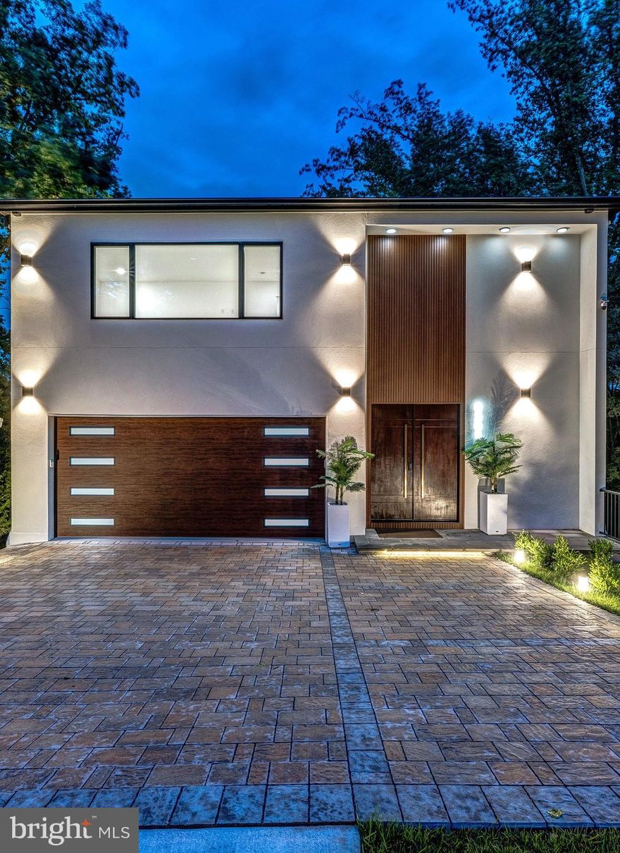 Location, location, location in a move in ready luxury NEW BUILD!  Sought after Donaldson Run is one of Arlington's most convenient neighborhoods just off Military Road and a 5 minute drive to Georgetown. 

.......Open the double entry doors to experience this sophisticated, extraordinary and captivating contemporary, designed with floor to ceiling Pella windows allowing for spectacular treetop views from every level of this high ceilinged four story residence.  Multiple balconies and wrap around terraces bring the outdoors in continuing the luxury aesthetic found throughout. 

The attention to detail in every room is unsurpassed.  Highlights include a stunning gourmet kitchen with a complimentary second catering kitchen.  Mini-bar areas welcome you on each level. The top of the line finishes throughout include Architectural Digest's best of the best:  Miele and Bosch appliances, Dekton countertops, custom Italian cabinetry, Kohler bathroom fixtures, backlit mirrors,  and floating vanities.  Smart home technology includes Alexa systems, Ecobee thermostats, Cat 6 wiring, Ubiquiti systems, and smart video/camera security systems. Three electric smart fireplaces, one on each level of the home.  A total of 5 expansive bedrooms and 5 full spa like baths, plus main level powder room.  Each bedroom provides an ensuite private bath along with custom closet systems. Additionally this residence is elevator ready to all levels. The main level two car garage opens onto a beautifully permeable paved motor court. Concrete construction with the latest technology throughout, along with generator ready and EV charging stations complete this extraordinary offering. The best value in new construction in close in Arlington.  Approximately 15 minutes to Reagan National Airport and 30 minutes to Dulles International Airport. 10 minutes to Sibley Hospital, 5 minutes to Washington Golf and Country Club and 10-15 minutes to multiple embassies. Hurry!  Make an appointment today to tour this exciting and well designed open floor plan, with all the right spaces for todays living.  Please email us for all appointments. 
NOTE: Tax Record has not been updated to reflect new construction and new home size.  Tax Assessment and Taxes are Estimated.