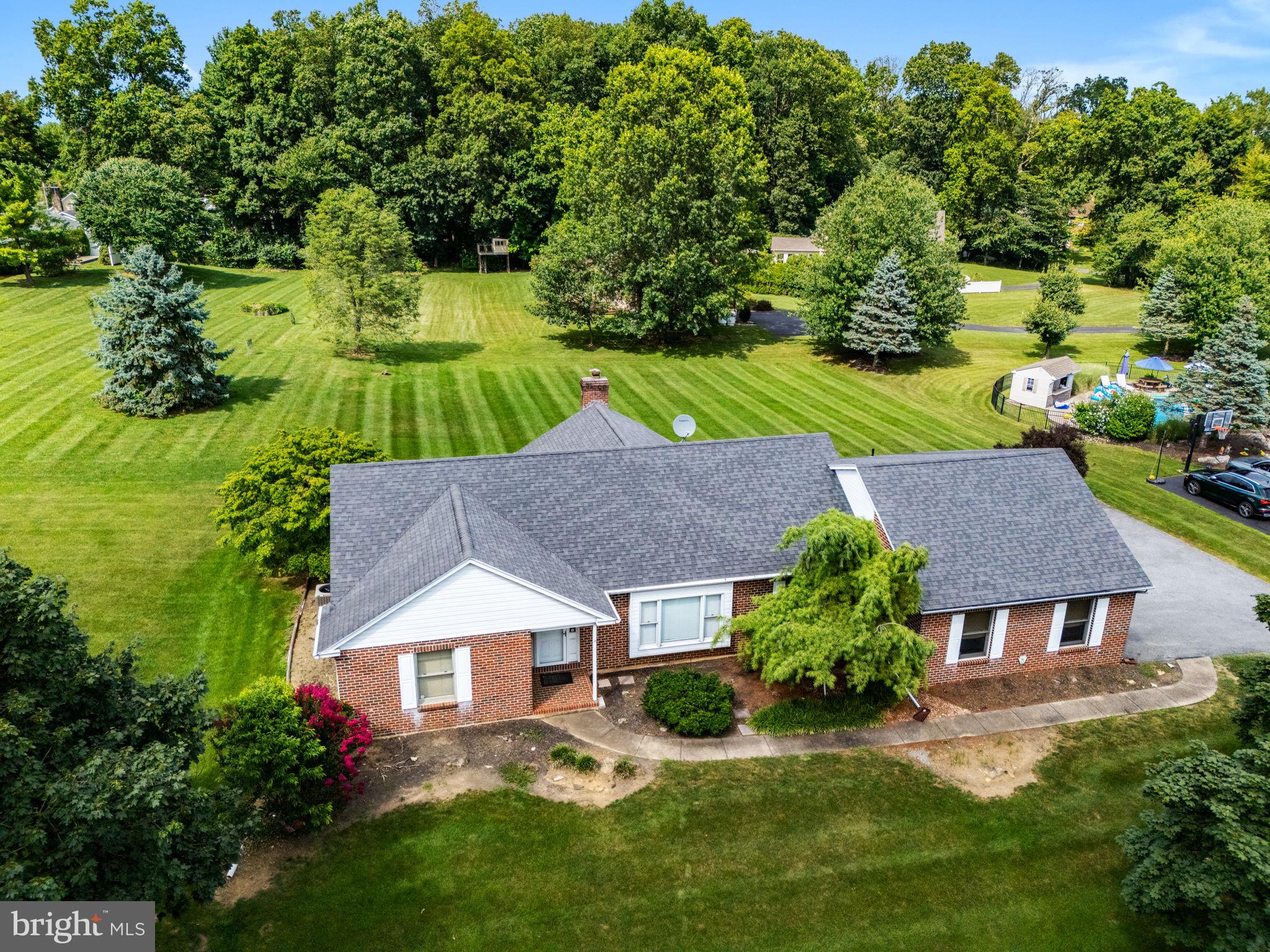 Fabulous East Penn Ranch on over a half-acre, open lot! One floor living at its best. Very convenient location to literally everything. Delightful, bright year-round Sunroom with wood-burning, brick fireplace and easy access to rear patio, complete with French doors! Open concept family room and kitchen combo. Extra spacious living room dining room area. All appliances and central vacuum remain. Huge, open span unfinished basement for future expansion. Very well maintained by this original owner! Make an offer today