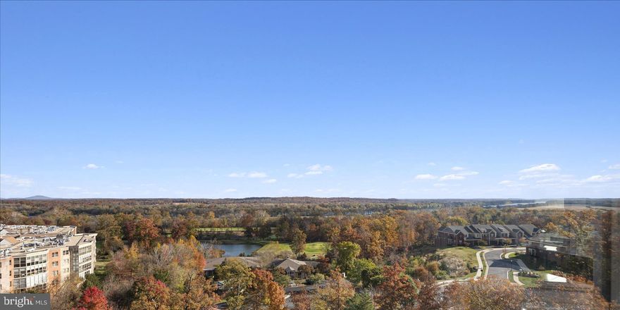 Experience easy, carefree living in this rarely available and fantastically affordable one-bedroom home, offering nearly 900 square feet of refreshed comfort and breathtaking views of the Potomac River and rolling golf course greens. Few residences capture such a perfect blend of value and scenery—where every glance out the window reminds you just how special this location is.

Freshly painted in a soft, neutral palette, the home feels bright and serene from the moment you step inside. The welcoming foyer, with its ceramic tile flooring and spacious coat closet, opens into a flowing layout designed for both comfort and flexibility.

The formal dining room features plush carpeting and crown molding offering a perfect setting for dinner gatherings or an ideal space to convert into a quiet home office or guest space.  Morning light dances across the ceramic tile in the eat-in kitchen, where you can linger over coffee while taking in the sweeping landscape beyond.  The expansive living room invites you to unwind, featuring soft carpeting, more classic crown molding, and a sliding glass door that leads to the sunroom. Wrapped in windows, the sunroom feels like your own private retreat, a perfect perch to watch the sunrise, follow the golfers below, or simply enjoy the gentle rhythm of the seasons.

The spacious bedroom offers more of those spectacular views, along with two closets including a large walk-in as well as convenient access to the in-unit washer and dryer (replaced in 2021). A full bathroom completes this thoughtfully designed home.

Practical updates include the HVAC system which was replaced in 2017. Recently refreshed with modern, calming interiors, this home is move-in ready and perfectly balanced between style and ease.

Beyond your front door, the building impresses with a beautifully renovated lobby and elegant hallways, reflecting a contemporary sense of sophistication. Ample parking is available just outside, and a dedicated storage cage adds convenience.

Life here is effortlessly inspiring. Whether you choose to lock and leave for your next adventure or stay and savor the resort-style amenities that make this community feel like a year-round getaway.  The magic of Lansdowne Woods extends far beyond your door. Life at Riverbend is vibrant, social, and full of opportunity. Condo fees cover an impressive array of services and amenities, resort-style features, hot and cold water, internet, cable TV, landline, trash removal, HVAC inspections, window washing, access to the community bus, and 24-hour security. For those who love to connect, the community calendar overflows with card games, coffee socials, happy hours, karaoke, bingo, potlucks, dance parties, and more. A theatre hosts films, lectures, and concerts, while over 40 clubs and year-round activities invite new hobbies and friendships. Wellness and recreation thrive here, too: a fitness center, indoor pool and hot tub, rooftop tennis and pickleball courts, and group exercise classes keep energy high. Creative outlets abound with a woodworking shop, ceramics, art, and music studios. For indulgence, there’s an on-site salon and a full-service restaurant and bar, along with EV charging stations for modern convenience. Whether you’re seeking lively community life or the quiet of your private retreat, Lansdowne Woods offers the best of both worlds. All just minutes from Dulles Airport, One Loudoun, Sterling, Ashburn, and Leesburg; with shopping, dining, commuter routes, and the Metro within easy reach.