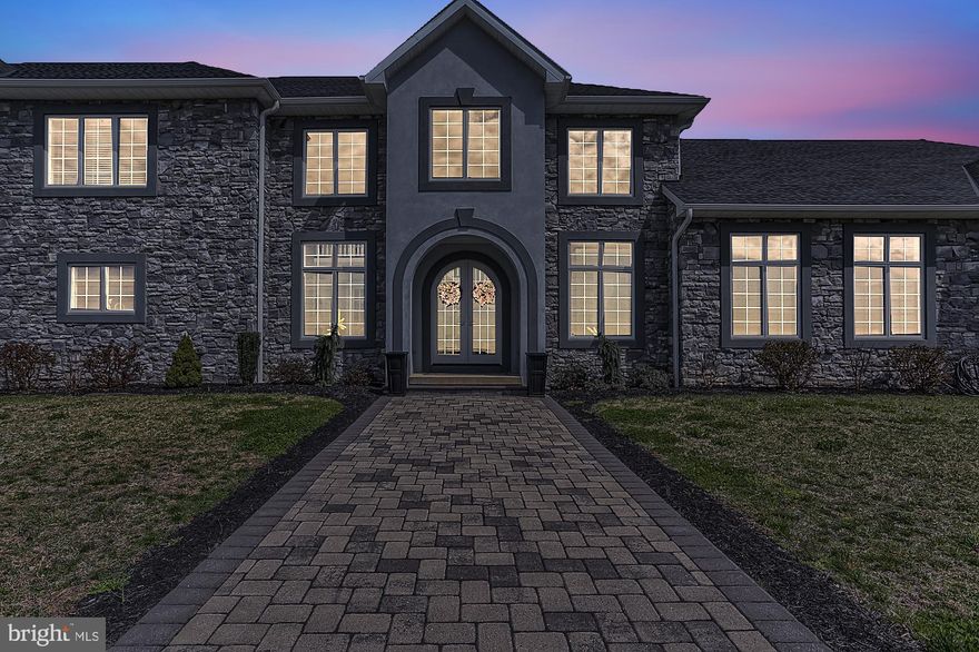 This wonderfully unique 5933 sq. ft. home is built high on a 26.68 acre hill for panoramic views and privacy.  This beautiful home was custom built in 2015 by McManus Homes for an extended family.  The impressive two-story foyer with an arched entrance and an open staircase is the focal point of the home.  The fabulous main level owner's suite with 10 ft. ceilings features an open floor plan with a coffered ceiling,  a custom white kitchen with a large island, granite counters, stainless appliances, pot filler, walk-in pantry, gas fireplace, sunlit dining area with built-in window seat,  den with built-ins, spacious owners bedroom suite with huge two person tile shower,  laundry & twin walk-in closets plus an oversized 2-car garage.  From the foyer both sides have easy access to the spacious media room with  a linear gas fireplace and patio doors to the covered rear porch.  The media room could be used as a large formal dining room.  The main house has an open floor plan with 9 ft. ceilings on the 1st floor.  Great room with a 2nd custom kitchen, granite counters, stainless appliances, pot filler, huge walk-in pantry and gorgeous views!  1st floor master bedroom suite with twin walk-in closets, spacious master bath with custom tile shower, Bubble Tub,  tile floor and dual vanities with granite.  Main level laundry.  Upstairs consists of 4 Bedrooms with 2 "Jack & Jill" baths and a large centrally located family room.  An attached oversize 3 car garage, an abundance of closet space and a full unfinished basement provide plenty of extra storage space or space to expand with a rough-in full bath.  The geo-thermal HVAC system provides reasonably priced heating and cooling for this large home. Security and sprinkler systems and Generac generator protect the home. A 20 gallon per minute well provides more than enough water.  This unique property is conveniently located only 2 miles from the Maryland line with easy access for the Maryland commuter.  There is possibility of subdivision.  The property is currently enrolled in Clean & Green for reduced property taxes.