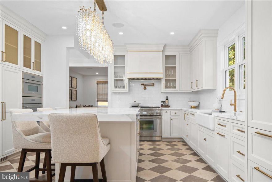 Everlasting in beauty for more than 121 years in the heart of Newtown Borough, 194 N Chancellor is an exquisitely restored and masterfully reimagined residence that makes an immediate and lasting impression. A seamless union of timeless architectural character and refined modern enhancements, the home offers exceptional craftsmanship and effortless, turn-key living in one of the area’s most coveted settings. No expense has been spared as you are greeted by a charming wrap-around front porch and newly installed white oak flooring, one is immediately enveloped in a sense of sophistication. This impactful impression is further enhanced by a thoughtfully designed layout, equally suited to vibrant entertaining and comfortable everyday living.  The historic integrity of the home has been preserved with intention yet modernized for functionality.  Inside, the inviting parlor room transitions effortlessly into a dedicated dining area, showcasing a distinctive exposed brick accent wall and original built-ins. The heart of the home, a luxurious kitchen designed by Village Handcrafted Cabinetry, boasts an opulent center island adorned with marble, top-of-the-line stainless steel Thermador appliances, gas cooking range, wall ovens, paneled Sub Zero refrigeration, a dedicated wine fridge, and a classic porcelain farm sink. This culinary haven extends into a convenient walk-in butler's pantry displaying the original exposed brick, natural lighting, additional cabinetry, and second sink. The first floor also features a cozy living room with a Mercer tile adorned gas fireplace.  A stunning sunroom with natural light offers direct access to an impressive covered deck featuring a vaulted ceiling and captivating views of the verdant backyard garden. Venturing upstairs, the second level accommodates three generously sized bedrooms with custom closets, two fully renovated bathrooms w/ radiant heated flooring, and a convenient laundry area. The entire third floor is devoted to the owner's suite, a private sanctuary boasting a revamped custom walk-in closet and a lavish en-suite bathroom with a dual-head walk-in shower and generous vanity space. Additional features include a fully finished basement with custom built-ins, a new security system, wine storage, a whole-home Sonos sound system, and an energy-efficient tankless hot water heater. With careful renovations meeting the highest standards, this home is equipped with all-new 200-amp electrical service, updated plumbing, new sewer line, and dual high-efficiency HVAC systems. Completing the property, a private, detached two-car garage barn provides a spacious workroom and an incredible unfinished space upstairs that's just waiting for your personalized touch.  Located just minutes from Newtown’s shops, dining, and amenities, this turn-key, fully updated historic residence presents a refined blend of character, modern comfort and incredible walkability in an exceptional location. A very special home where old-world charm meets modern design in beautiful Bucks County, PA.