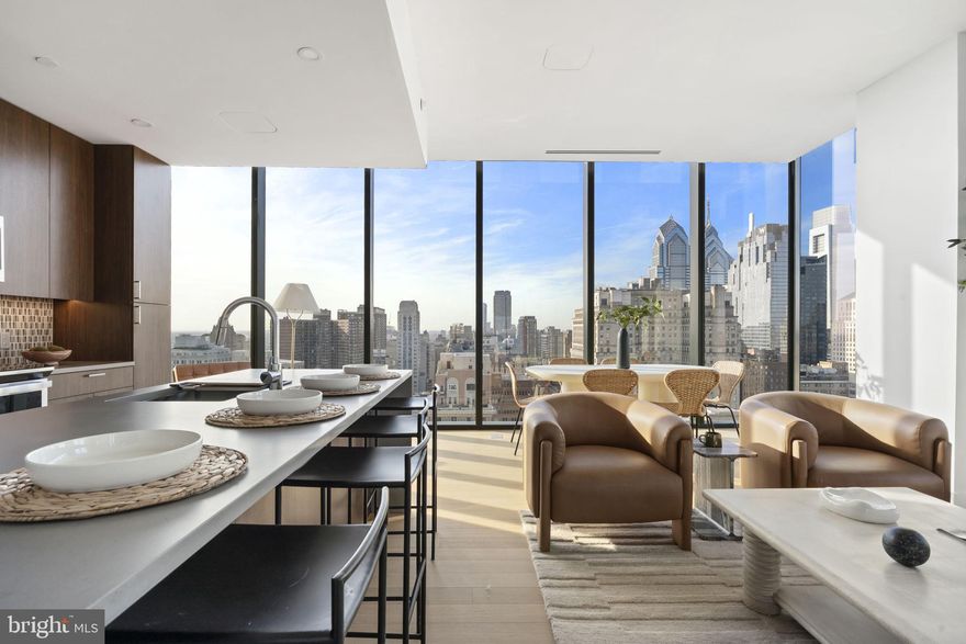 Welcome to Penthouse PHC2, a 3-bedroom, 3 bathroom , 1,650 sq. ft. residence in the architecturally acclaimed 210 South 12th, a 32-story luxury tower designed by RSHP (formerly Rogers Stirk Harbour + Partners), founded by Pritzker Prize winning architect Richard Rogers. This modern building offers a premier Center City lifestyle with exceptional amenities and thoughtfully designed residences.

Residents enjoy access to three levels of amenities, including:
• State-of-the-art outdoor pool and lounge
• Fitness center with advanced equipment
• Dedicated yoga and wellness studios
• Resident lounges and co-working areas
• Multiple outdoor terraces with sweeping city views
• Pet-friendly amenities
• 24/7 concierge and secure entry
• 100 % Ev-equipped Automated Parking
 
Inside PHC2, floor-to-ceiling windows frame stunning skyline views and fill the home with natural light. The kitchen features Caesarstone® countertops, walnut-style cabinetry, a chic European backsplash, and an expansive pantry. Additional highlights include a discreet VRF A/C system, keyless entry, generous storage throughout, and large walk-in closets in the primary suite. Bathrooms showcase elegant European tilework and modern fixtures.

210 South 12th also includes three ground-floor retail spaces, one providing access to a second-floor retail level, with 376 residential units above, creating a vibrant, connected, and elevated Center City living experience.