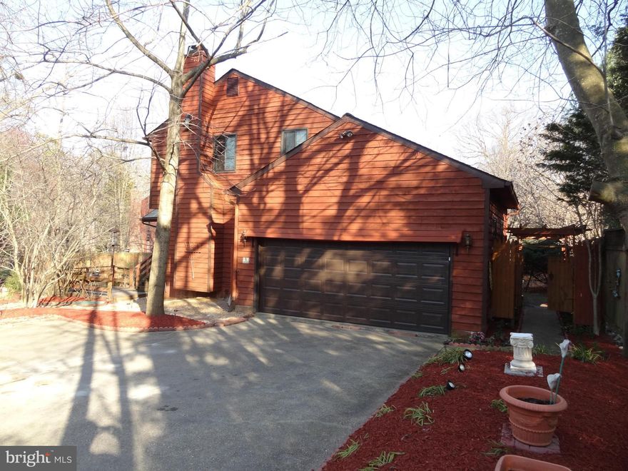 Backing to wooded privacy, this ideal SP cul-de-sac location is convenient to SPHS, SPES & B&A trail. A home for all seasons, this lovely contemporary 3 level home offers a spacious, open, sun-filled great rm, fam rm w/ wood burning F/P, rear screened porch, Sun/Florida Rm, skylights, 2 car garage & fun community! Features upgraded windows, fin. basement w/ high ceiling & tucked back from street.