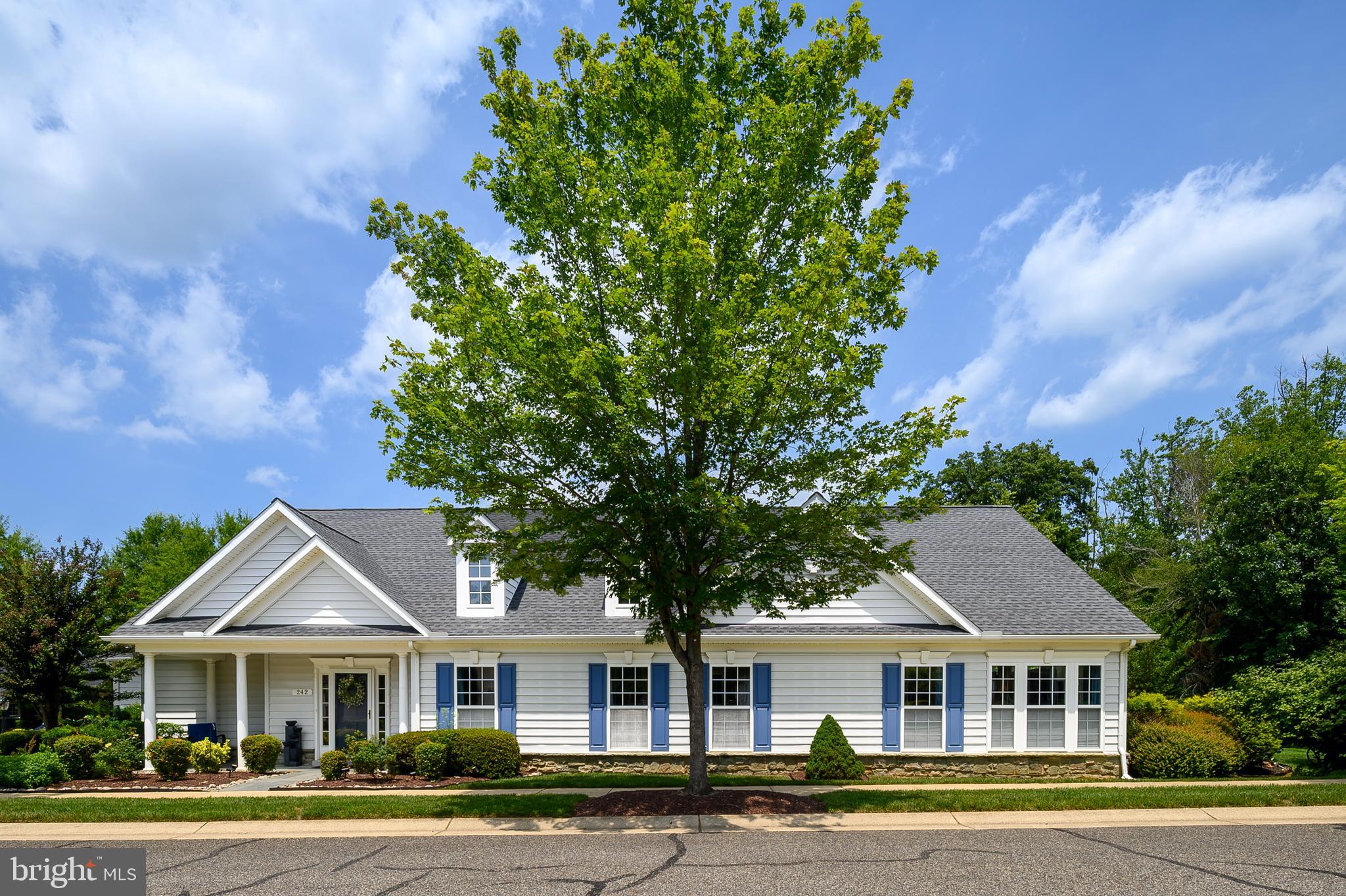 WELCOME HOME TO YOUR PRIVATE OASIS at 242 Opera Ct. beautiful Brahms model in Symphony Village is the most sought after 55+ Active Adult Community in Queen Anne's County. Completely built out with 395 homes . This community offers many amenities for it's residents including a Club House, Interior Heated Pool, Exterior Pool, Pickle Ball Courts, Walking/Jogging/Bike Paths, Fitness Center, Putting Green, Bocce Court, Billiards Room, Bar, Party rooms, Dining room, Card Night , Arts and Crafts, Painting Nights ,There is a very active artists' guild, and a quarterly art show (with an opening reception) celebrates the wonderful artistic talents of residents. and so much more, all at a low monthly HOA fee of $260.00 a month. Oh and don't bring your Lawn Mower the HOA covers cutting your grass too! This home has 3 bedroom, 2 full bath. Delightful owner's suite has a tray ceiling and a sitting room extension, two walk-in closets, and a spacious bathroom with a corner soaking tub, large shower, separate vanities and tile flooring. The second bedroom is located down a hallway with an adjacent bathroom, and the third bedroom has lots of natural light and is suitable for use as an office. 242 Opera Ct has been freshly painted and the lot is a corner lot very private w/back garden surrounded by trees. There is plenty of room to entertain of the patio and for your dogs to run along with enjoying to watch the wildlife while drinking your morning coffee or having an quiet evening outside! Family room has a solarium extension with a vaulted ceiling, . This beautiful home features hardwood flooring a upgraded beautiful gourmet kitchen with stainless appliances, granite counter tops and plenty of room for all of your chef's. The laundry room leads to the two-car garage, which has extra space for storage.. a gas fireplace along with a New roof, and several recent replacements include the HVAC system, water heater, dishwasher, microwave and cooktop. Short walk the community walking path and wooded area. A trail leads through the cornfield to the nearby shopping center, with a Dunkin' Donuts along the way. The town of Centreville is very charming, and there are several restaurants in town. The Wharf is a place to launch your boat or have a picnic. Easy drive to Chestertown, Easton, St. Michaels and Annapolis. The Atlantic beaches are not too far away either. This home will not last long it is move in ready! Call and schedule your showing today