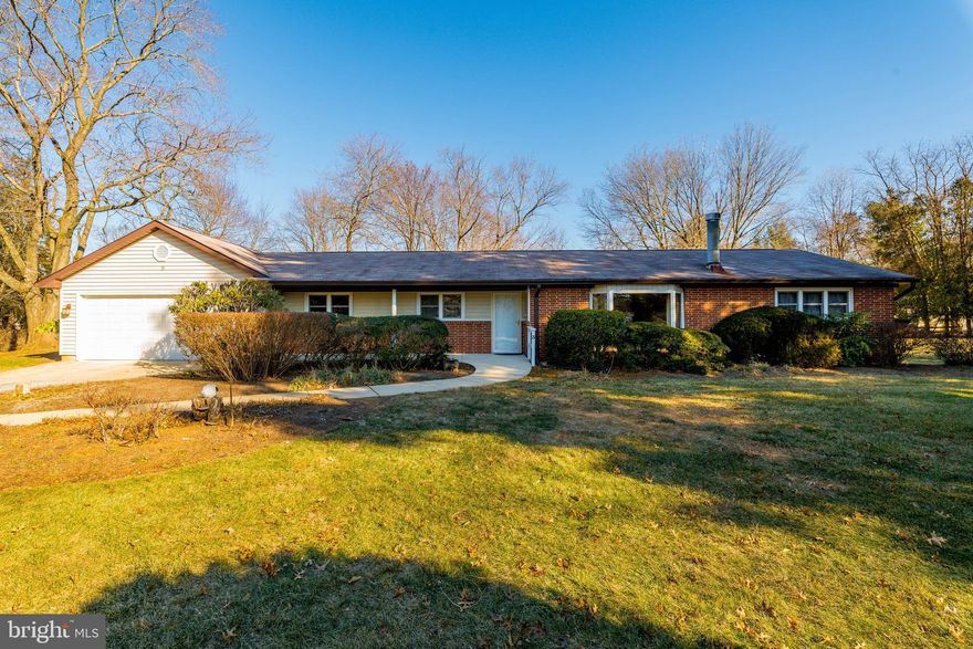 Sprawling rancher on a beautiful, flat lot with huge great room addition!  This light-filled home has so many rooms!  The living room features hardwood floors and built-in bookshelves and is so spacious.  At one end of the house are three large bedrooms and 1.5 baths.  At the other end of the house is a lovely kitchen and a breakfast room with access to the deck and beautiful backyard.  A dining room that is currently being used as a den is off of the kitchen/breakfast room.  A large fourth bedroom is also at this end of the house, along with laundry.  The big surprise is the enormous new great room addition with cathedral ceilings, huge windows, and a sliding door out to the yard.  Enjoy spending time on the lovely deck, watching the birds and enjoying the view.  This house is so special and has been lovingly cared for.  Must see to truly appreciate!