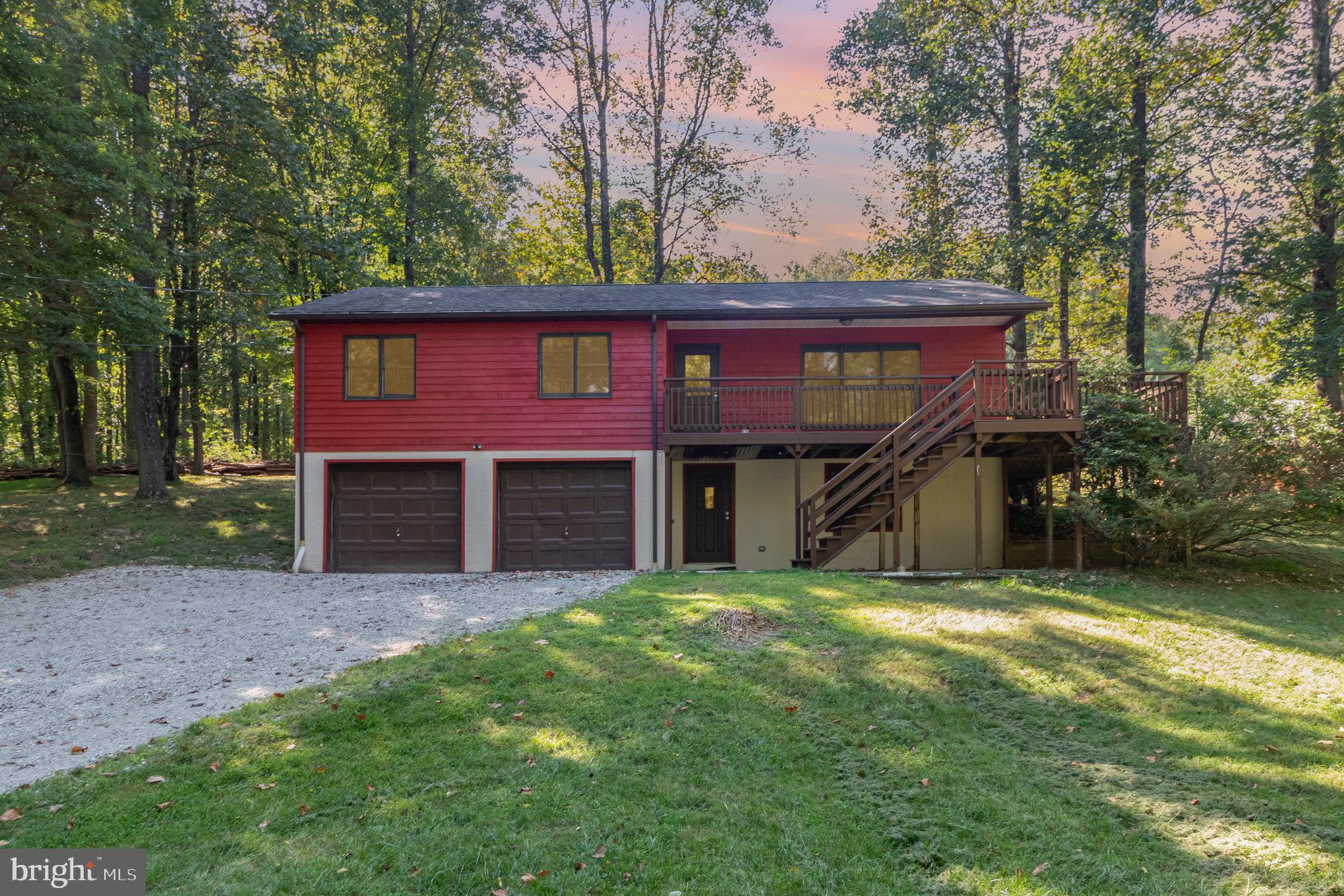 Welcome to 31 Eagles Trail in Fairfield, a peaceful retreat minutes from the slopes.
Tucked away on a quiet hillside in the heart of Carroll Valley, this charming raised ranch offers a perfect blend of privacy, space, and location. Just minutes from Liberty Mountain Resort, it’s a rare opportunity to own a versatile home surrounded by nature—with room to relax, gather, and explore.
Inside, you’ll find three comfortable bedrooms, two full baths, and an inviting layout designed for everyday living. The main level features a light-filled living space and a beautifully updated kitchen, complete with sleek granite countertops and stainless steel appliances. The primary suite includes a private full bath, while two additional bedrooms offer flexibility for guests, home office space, or family living. New LVP flooring, plush carpet, and custom built-in shelving add both style and function.
Step outside to the expansive wrap-around deck, where wooded views and fresh mountain air create the perfect backdrop for morning coffee or evening sunsets.
Downstairs, a finished lower level includes a large recreation room and a bonus room that’s perfect as a guest space, office, or fourth bedroom. A two-car garage and storage area provide plenty of space for outdoor gear, tools, and more.
Located just 3 miles from the Maryland line and a short drive to Gettysburg, this home offers easy access to year-round activities—from skiing and golfing to hiking and historic sightseeing. Schedule your showing today!