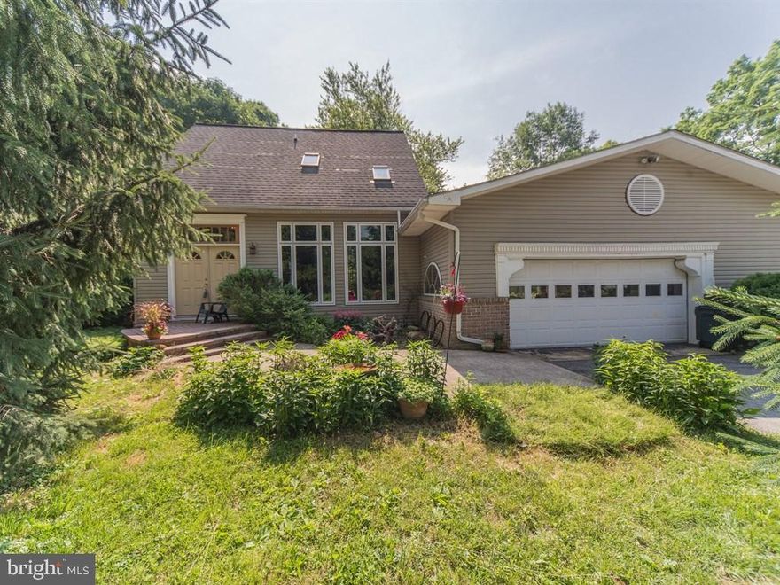 A very uniquely designed post & beam home with many architectural features. Reclaimed beams, pillars, doors, flooring & wood from local barns, churches & schools give an unmatched historical charm. Three gas fireplaces for ambience. Multiple outdoor living spaces offer a place to relax & enjoy the beauty & serenity of the rural 1 acre lot. Recent upgrades include new front windows, entry door & deck in 2011.