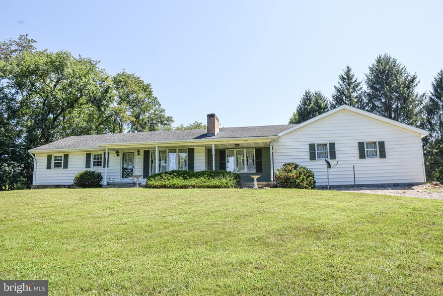 Inviting 3-Bedroom Home on 2.99 Unrestricted Acres

Discover the potential of this 3-bedroom, 1-bath home situated on 2.99 unrestricted acres with valuable road frontage on Back Creek Valley Road. Being sold as is, this property offers a rare opportunity for those seeking space, versatility, and country living with no HOA restrictions.

Inside, you’ll find a welcoming family room with a bay window that fills the space with natural light, along with a cozy wood-burning fireplace for those cooler evenings. The living room, located just off the attached 2-car garage, features an electric fireplace for added warmth and charm. Several rooms with white carpet have the original hardwood floors preserved underneath, ready to be revealed and restored.

The exterior offers plenty of space for hobbies, projects, or animals, with a workshop/barn included. Relax and enjoy the peaceful surroundings from the covered front porch or entertain guests on the back deck.

Whether you’re looking to renovate, expand, or simply enjoy a home with land and freedom, this property is full of possibilities.
