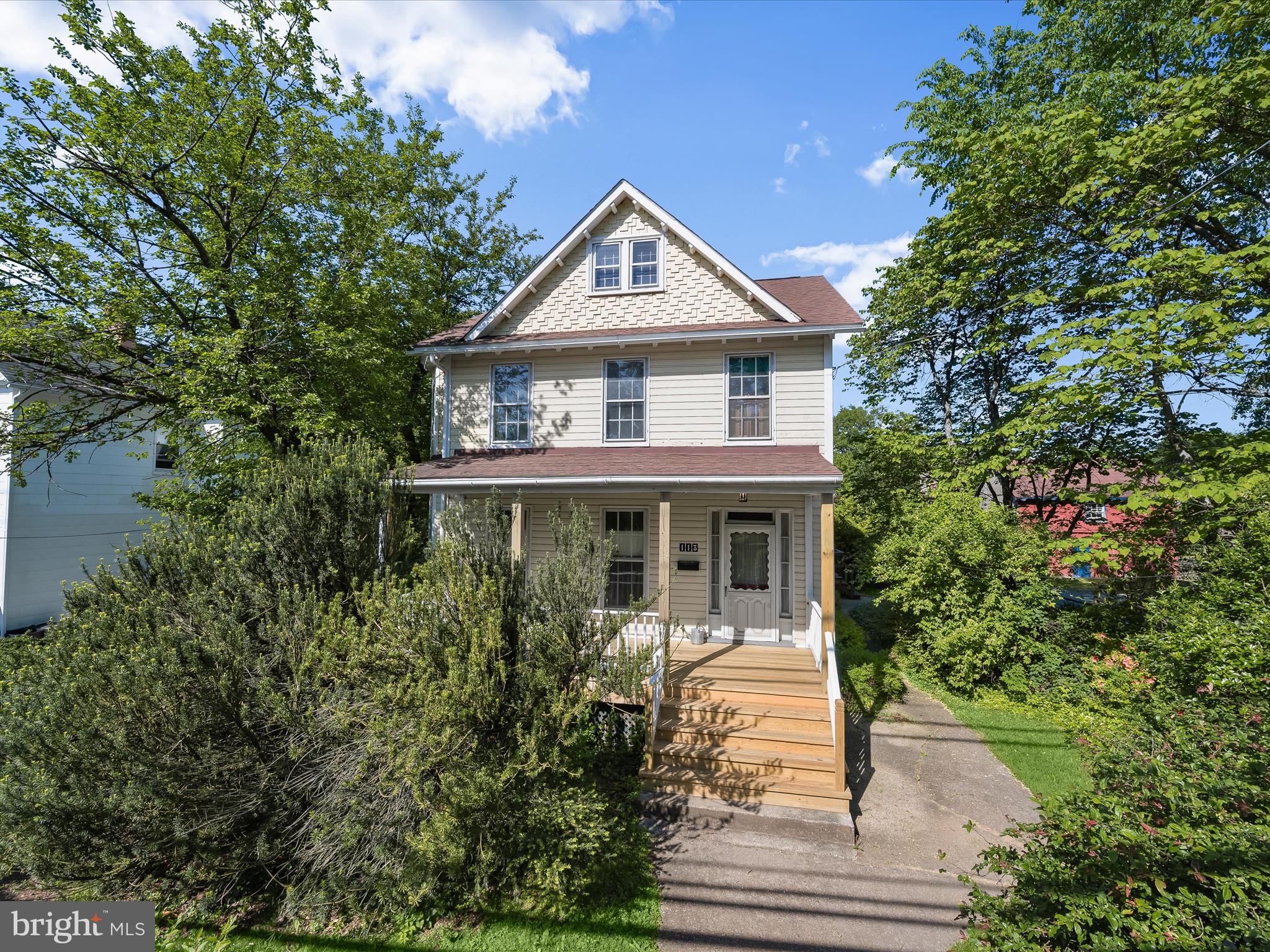 ***This home just got better with a new offer price! *** Nestled in the heart of Catonsville, this original 1850 farmhouse sits on a generous .55-acre lot and offers a rare blend of history, character, and warmth. From the street, the home’s inviting covered front porch with recently updated boards welcomes you with timeless charm. Inside, you'll find high ceilings, large windows, and thoughtful architectural details like bump outs and antique doorknobs that hint at the home's rich past. Step into the foyer and to the left is a light-filled living room with a stately fireplace and a cozy windowed bump out. Beyond that lies a den, and adjacent to it, a formal dining room framed by French doors, perfect for hosting dinner parties or holiday gatherings. The kitchen, tucked further back, features a vintage Chambers range, farmhouse sink, walk-in pantry, and access to a side porch. A full bath just off the kitchen adds convenience. Toward the rear, a versatile room with an atrium door to the deck and a transom window overhead would make an ideal home office, studio, or hobby space. Beautiful wood railings and detailed newel posts lead the way upstairs, where the primary bedroom offers more charming bump outs and abundant natural light. Three additional bedrooms, two full baths (two of the full baths in the home have stand alone tubs), and an upper-level laundry room provide plenty of space for both functionality and comfort. The upper level also offers its own side porch entrance and walk-up access to a spacious, floored attic that is ready for finishing. Outside, the covered back deck overlooks mature trees, including fig trees, and garden beds. It is an ideal setting for weekend brunches, evening drinks, or simply enjoying the outdoors. While the home is full of history, charm and warmth, it welcomes your vision to shine. Walkability is a plus being located so close to the amazing restaurants and shops that Catonsville has to offer.