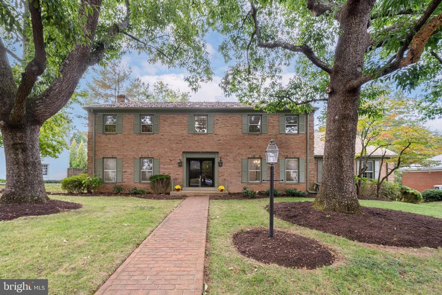 Known as “The Admiral’s House,” this stately all-brick Colonial sits on a quiet street in the prized Evermay neighborhood, admired for its mature trees, large lots, and its walkability. This exceptional property presents a rare opportunity to own one of Evermay’s signature homes and make it your own. Built by Gene May in 1974, the residence offers just over 6,500 square feet of living space with five bedrooms, with four having walk-in closets, and four full baths. 
Freshly painted interiors complement a traditional floor plan featuring elegant formal rooms, including a spacious living room, dining room, library/office, and family room open to the kitchen with updated appliances. The expansive partially finished lower level—with hookups for a potential second kitchen—is ready to be customized to suit your lifestyle.
Evermay offers a serene residential setting just minutes from downtown McLean and Tysons. Its prime location provides easy access to the George Washington Parkway, Washington, D.C., and walking distance to Potomac School, making it one of McLean’s most desirable enclaves.