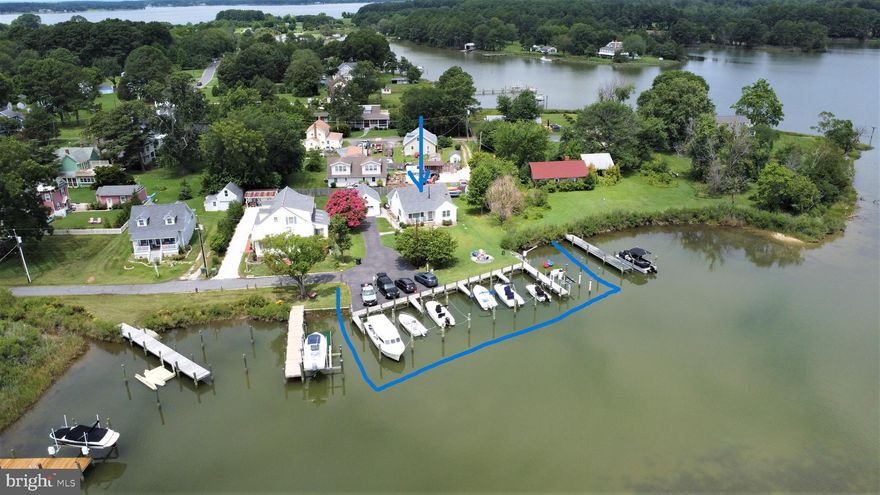 Enjoy this picturesque waterfront cottage nestled in historic Neavitt, minutes from St. Michaels.  Unique and private this property is overlooking Duck Cove and Balls Creek situated at the end of Duck Cove .   This cottage is unique it has 8 boats slips with all new finger piers, 1 boat lift rated at 1500lbs, a davit for jet skis also rated at 1500lbs, bulkheading, water, and lighting .  The dock was built by Weems Marine Construction considered one of the best contractors on the Shore.  Brand new roof on house, garage, and outbuilding.  This charming cottage offers 2 bedrooms on the main floor with a full bathroom, large picture window in the family room with propane gas fireplace/stove, eat in kitchen, large laundry/ mudroom, and water views from every room.  The second floor has a large master suite with custom shower and spacious bathroom.   Detached vaulted ceiling one car garage with a newly paved driveway.  Large spacious yard boosts a new firepit, for outdoor activities and entertaining.  This property has been a highly successful vacation rental with 8 rental boat slips.  Property will be connected to public sewer (expected by 2027) in Neavitt, once it is installed in the town.   Neavitt has many amenities, Neavitt Park, pavilion, community center , and Talbot County public landing .  Enjoy this quaint waterfront community and all it has to offer.