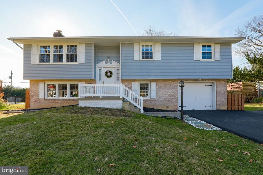 4 bedroom bi level home in Manheim Township schools backing up to The Manheim Township Middle and High school campus.  This home features a bright kitchen with updated appliances, updated bathrooms with ceramic tile, finished walkout lower level  with built in shelves, brick surround fireplace and fresh paint throughout home.