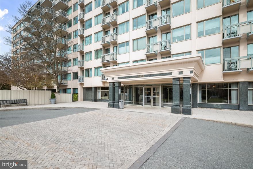 Spacious and beautifully appointed 2-bedroom, 2-bath condo tucked away on the quieter side of the amenity-rich Whitley Park Condo community.  A grand lobby entrance with inviting gathering spaces sets a welcoming tone.  Inside, the sun-drenched open floor plan features elegant Brazilian cherry hardwood flooring throughout the living and dining areas, highlighted by a stunning crystal chandelier.  The custom kitchen is thoughtfully designed with granite countertops, stainless steel appliances, and a cutout opening offering clear sightlines into the main living space, ideal for everyday living and entertaining.  The hallway is accented by a custom built-in bookcase and leads to a versatile guest bedroom featuring a dedicated home office nook.  The primary suite offers a spacious retreat with a walk-in closet and a luxurious en suite bath complete with dual vanities, a jetted soaking tub, and a separate shower.  A convenient in-unit laundry and basement storage room add everyday practicality.   Enjoy a variety of community amenities, including a swimming pool and sports courts.  Conveniently located near major commuter routes and just minutes from shopping, dining, and entertainment, this home combines comfort, style, and convenience. (some photos have been virtually staged)