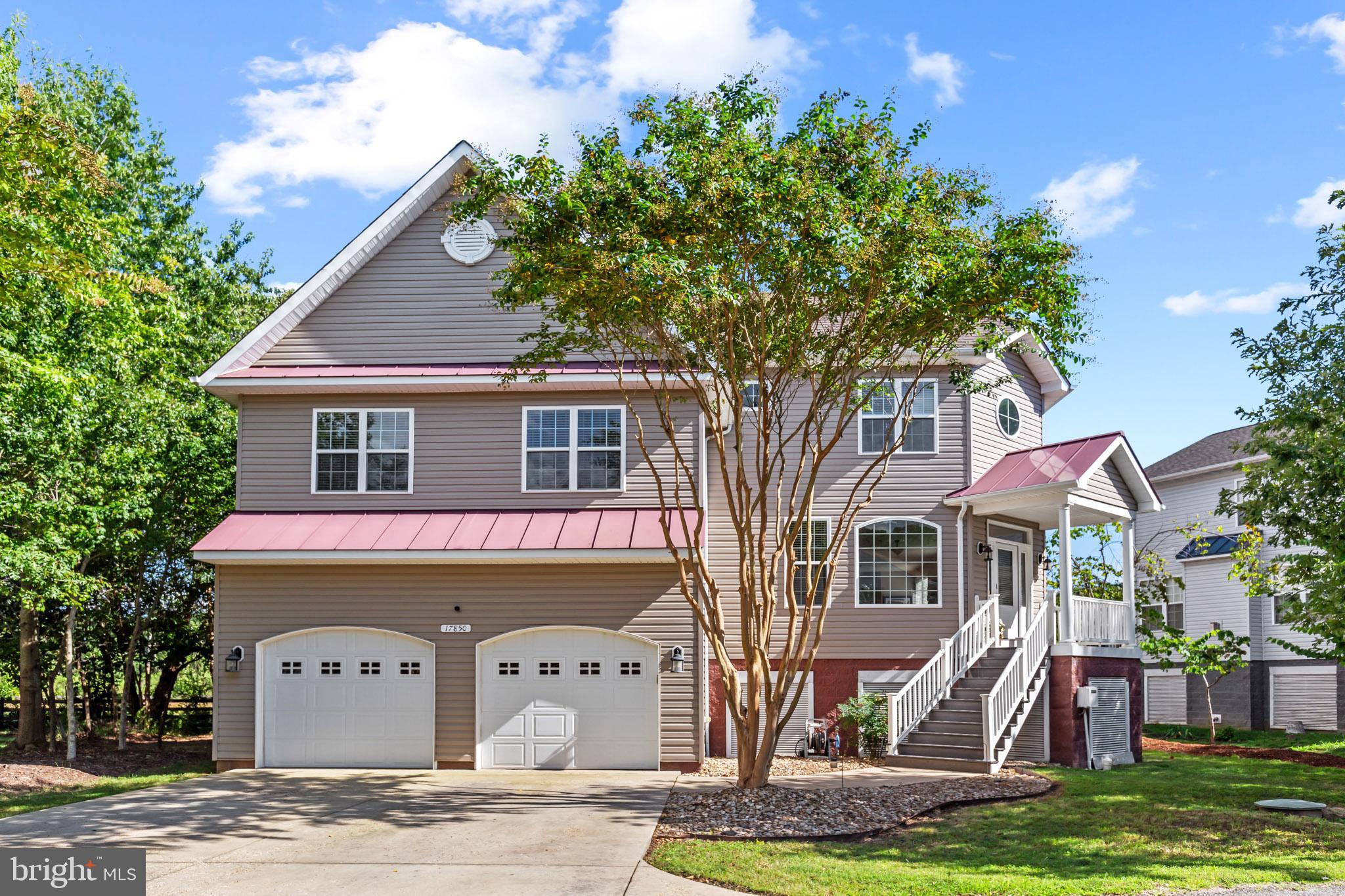 Coastal Charm in Tall Timbers!! Welcome to 17850 4th Street, a beautifully designed 4-bedroom, 3.5-bath coastal-style home offering over 2,450 square feet of living space just minutes from Saint George Island, public boat ramps, beaches, and parks. Step inside and be greeted by gleaming hardwood floors, soaring 9 ft ceilings, and an abundance of natural light that enhances the home’s open-concept design. The gourmet kitchen is a chef’s delight with granite countertops, 42-inch cabinetry, stainless steel appliances, gas cooking, and a convenient wet bar for entertaining. The living room features a cozy gas fireplace, perfect for relaxing evenings. Upstairs, the spacious bedrooms include a Jack-and-Jill bath and a luxurious primary suite with updated LVP flooring in the primary bath. Additional highlights include, Dual-zone HVAC for comfort year-round, reverse osmosis water filtration system, oversized 12 ft ceiling garage with walk-in crawl space and public sewer. Enjoy the quiet farm backdrop on the expansive deck out back. This home offers the best of both worlds—peaceful living with easy access to the water, recreation, and coastal beauty while being 10 minutes or less from route 5 shopping, restaurants etc and an easy commute to PAX River NAS! Book your showing today!!