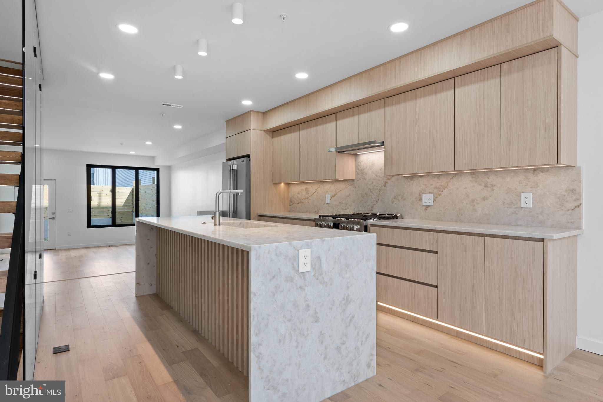 Discover unparalleled luxury at 1619 N 3rd Street, nestled in vibrant Olde Kensington, Philadelphia. This stunning new construction home with a 10 year approved tax abatement offers over 3,200 sq. ft. of above-ground living space, plus a fully finished 780 sq. ft. basement. Designed with modern living in mind, it features custom European windows, energy-efficient construction, and custom finishes throughout, far from a cookie cutter home. Indulge in 4 spa-inspired bathrooms with smart toilets, floating vanities, and a Moroccan Hammam spa. Two primary suites include spacious custom walk-in closets curated by a skilled carpenter, while a lighted floating staircase serves as a striking centerpiece. Enjoy seamless indoor-outdoor living with three outdoor spaces: a large backyard with green and patio areas, a private balcony, and a roof deck with stunning city views. Modern neutral finishes, two-zone central heating and cooling, and thoughtful design make this property a true urban oasis. Estimated delivery: end of March 2025.