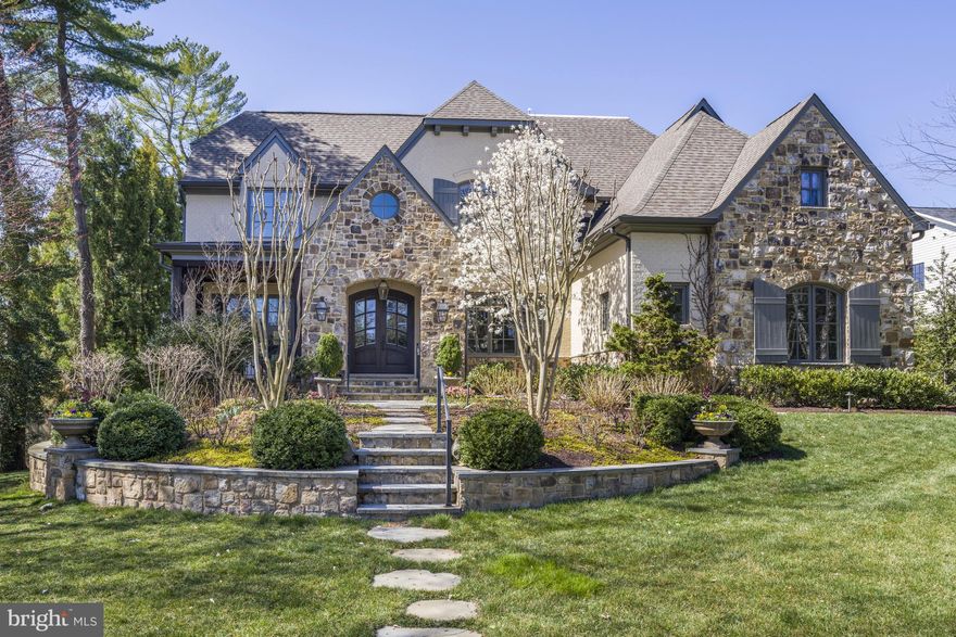 This magnificent French Country estate is a true sanctuary, offering an exceptional backyard designed for ultimate relaxation and entertainment. A resort-style pool with a cascading waterfall, an outdoor kitchen, and a stone patio with a built-in fire pit create the perfect setting for unforgettable gatherings. Step inside to discover a home filled with exquisite architectural details. The inviting foyer leads to the elegant Living Room, where a cozy fireplace adds warmth and charm, seamlessly flowing into the sophisticated Dining Room. The gourmet Kitchen is a chef’s dream, it features a spacious breakfast nook, a large island with bar seating, and top-of-the-line appliances, making it perfect for culinary creations. The expansive Great Room, with its soaring beamed ceiling and striking stone fireplace, serves as the heart of the home. On the main level, you'll also find a beautifully paneled Library, a screened-in Porch with its own fireplace, and a Terrace offering stunning views of the picturesque backyard. Upstairs, the luxurious Owner’s Suite offers a private retreat, highlighted by a vaulted ceiling, a custom walk-in closet, and a spa-inspired bath with dual vanities and heated flooring for the ultimate in comfort. To complete the upper level, there are 3 ensuites and the laundry room. The walk-out lower level is an entertainer’s paradise, featuring a custom Wet Bar, a Wine Cellar, a recreation room, a Fitness Room, and an additional Bedroom and Bath. With a three-car garage and an unbeatable location just two stoplights from Washington, D.C., and minutes from Downtown McLean, Tysons, the GW Parkway, and all major airports, this home offers both convenience and unparalleled elegance.