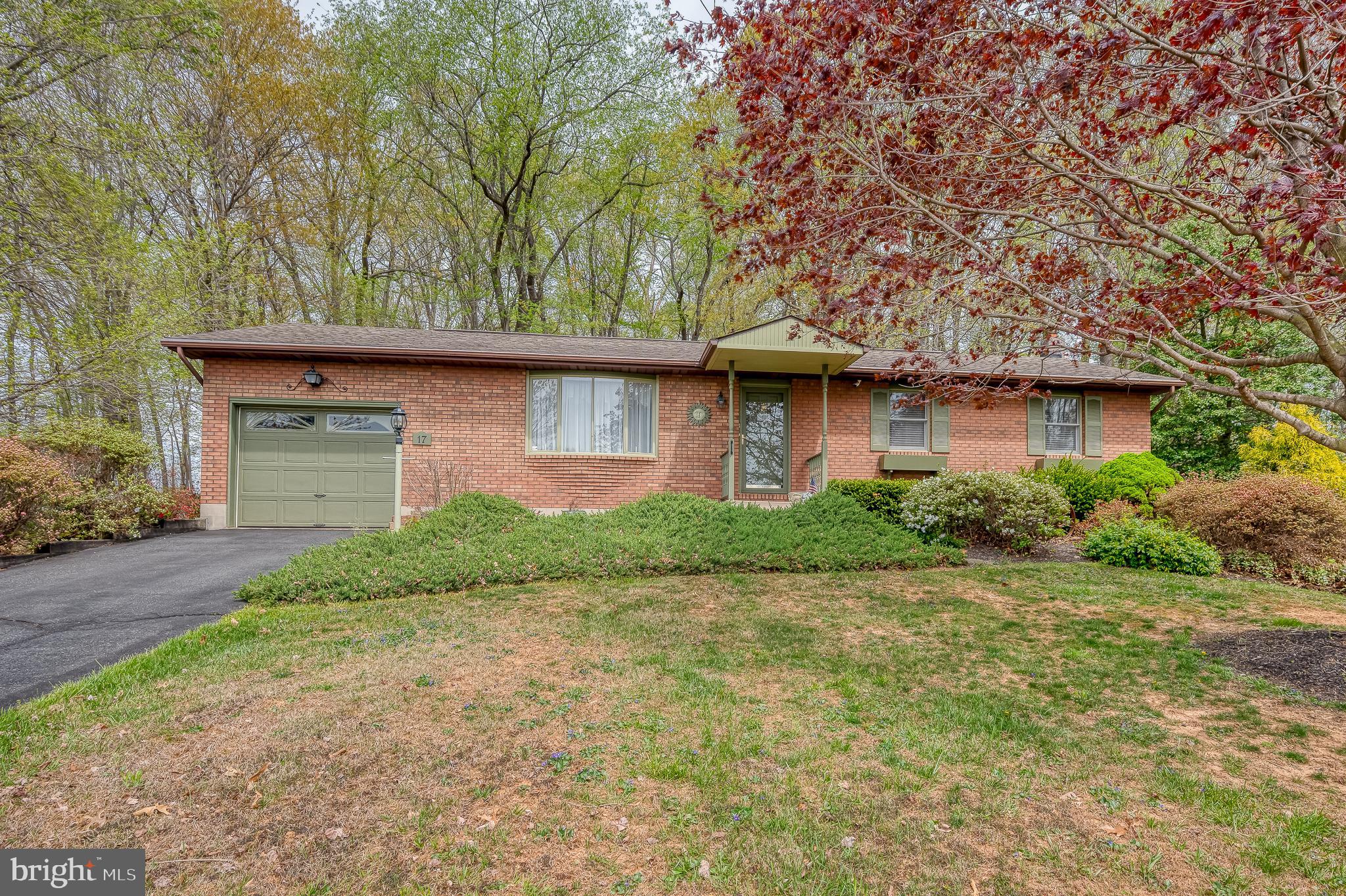 Set on a partly wooded lot in York County’s Peach Bottom Township, this 3-bedroom, 2-bath rancher offers the ease of single-level living with added finished space on the lower level. Inside, the living room welcomes you with a bay window, built-in shelving, and laminate flooring that flows into the dining area—complete with a sliding glass door that opens to the double rear deck. The kitchen, expanded for everyday function, features tile flooring, quartz countertops, recessed and pendant lighting, a center island, wall oven, built-in cooktop, double sink, and a ceiling fan. While the kitchen and baths could benefit from updating, the space is generous and ready to be personalized. The primary bedroom includes carpet, a ceiling fan, window treatments, and a private en-suite bath with a stall shower, sconce lighting, and vinyl flooring. Two additional bedrooms offer a mix of laminate and carpet, both with window treatments and one with a ceiling fan. A full hall bath includes a tub/shower combo, sconce lighting, and vinyl flooring. The finished lower level adds versatility with a family room featuring carpet, paneled walls, recessed lighting, and a pellet stove with a brick backdrop—perfect for cozy evenings. A separate recreation room with vinyl flooring and paneled walls provides even more usable space for hobbies, play, or storage. The laundry area is also located on this level. Outside, enjoy a spacious double deck overlooking the backyard with play equipment, a storage shed, and surrounding greenery. The one-car attached garage and asphalt driveway provide convenient parking and entry.
