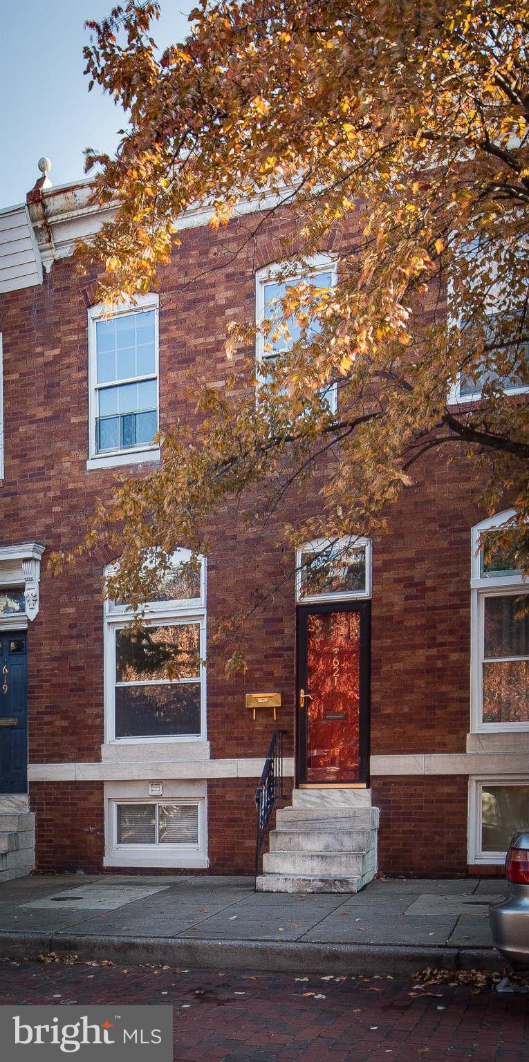 Great location on this extra wide tree lined Canton street within walking distance to Canton Square, Patterson Park, Fells Point, and more. Pergo flooring throughout main level. Updated kitchen with exposed brick and room for your kitchen table. Updated baths. New rear deck. Bonus sitting room or den great for a home office, and full bath with separate shower and soaking tub. Freshly painted.