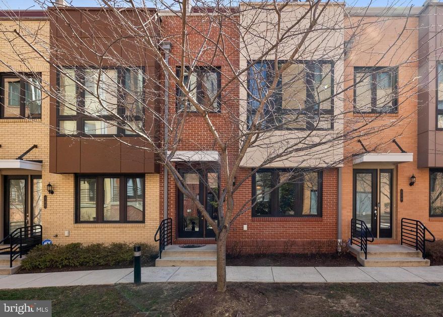 This stunning 4-level townhome in Cambria Square offers both beauty and functionality. A peaceful courtyard, adorned with charming cherry blossom trees, leads you to the front door. Inside, you'll find an upgraded interior with hardwood floors, soaring ceilings, upgraded light fixtures. Designer paint, custom shades and drapery throughout add elegance to the property. The open-concept design is highlighted by large windows, allowing natural light to flood the upper levels. The gourmet kitchen is a chef's dream, featuring sleek quartz countertops, a gas cooktop, custom backsplash, stainless steel appliances, a spacious pantry, and an expansive center island with a breakfast bar and built-ins. The adjoining dining area is perfect for hosting gatherings, comfortably accommodating family and friends.
The two upper levels offer four bedrooms in total, including a generously sized primary suite with two walk-in closets and a private bath with a double vanity. A laundry closet on the same level adds convenience to everyday living. The top level provides an ideal space for entertaining, with a rooftop terrace that boasts a double-sided fireplace for a cozy ambiance and impressive views. It's also roughed in for a wet bar, making it the perfect spot for both relaxation and socializing. Two Ethernet ports in every bedroom, loft and living room. Loft is pre-wired for surround sound. Culligan soft water system is included. 
The lower level presents a versatile space that could be designed as a rec room or an au pair suite, with high ceilings and storage closet. Additional features include a 2-car attached garage with private parking and easy access to the lower level. Ample guest parking is available throughout the community. Enjoy walking paths through Cameron Station leading to Ben Brenman Park, and take advantage of easy access to I-395 and I-495, Old Town, DC, the Pentagon, and Arlington. Cambria Square is a well-maintained community, and the $337 monthly condo fee covers common area and exterior building maintenance, insurance, lawn care, and snow removal.