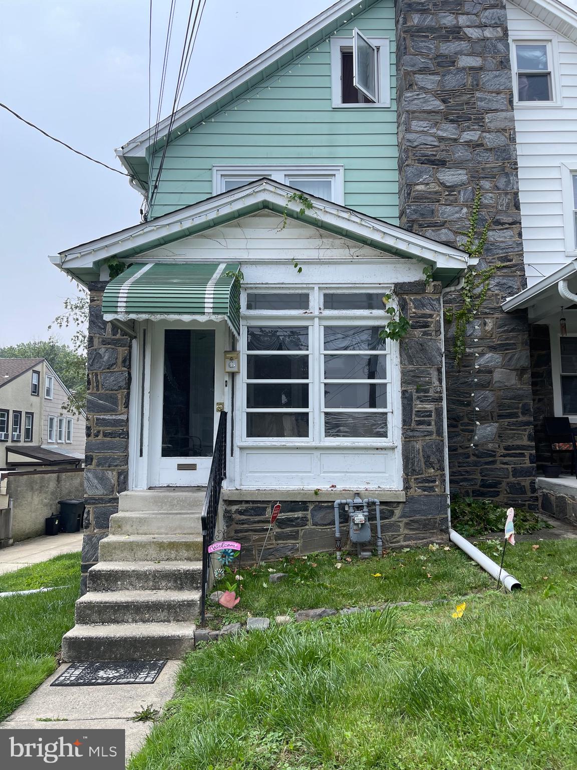 This is the large stone home in sought after Drexel Hill you have been waiting for. Featuring 5 bedrooms 2 full baths, with hardwood flooring throughout. Enjoy an enormous custom kitchen with a center Island, plenty of storage and an outside entrance. The light filled living and dining rooms are large and open with access to an enclosed front porch. 2nd Floor has 3 generous sized bedrooms with a large hall bath,3rd floor houses 2 additional bedroom and a 2nd hall bath. Basement is large with high ceilings and exits to the side driveway, where there is parking for 4 to 5 vehicles. Central air is zoned for the 2nd & 3rd floors only. This location is only moments from shopping, restaurants, Center City & much more. Don't delay make your appointment today!