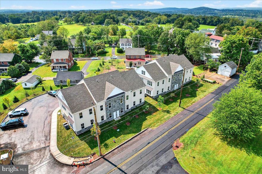 Phase 2 is now underway at Lederach Village, introducing Isabelle Court , a new collection of thoughtfully designed two-floor living townhomes in the heart of Harleysville.  Welcome to Lederach Village, where timeless design meets modern luxury. This exclusive community now features one and two -level home designs that offer open layouts, elegant finishes, and an emphasis on comfortable, easy living. 
This particular home is a bi-level design featuring 3 bedrooms and 3 full bathrooms, offering both space and flexibility for modern living.  Inside, homeowners will enjoy chef-inspired kitchens with quartz countertops, high-end cabinetry, designer fixtures, and spacious center islands — perfect for entertaining and everyday living. Homes are beautifully finished with 7" plank engineered flooring and carpeting, creating a warm and sophisticated atmosphere throughout.
The private primary suite serves as a relaxing retreat, complete with a beautifully appointed primary bath featuring tile finishes, elegant fixtures, and generous cabinetry. Additional bedrooms and full bathrooms provide comfortable accommodations for guests, family, or a home office.
These to-be-built homes feature open floor plans, private patios, and a prime location in the heart of Harleysville, just minutes from shopping, dining, parks, and golf courses. Buyers still have the opportunity to customize finishes and personalize their home, making each residence truly their own