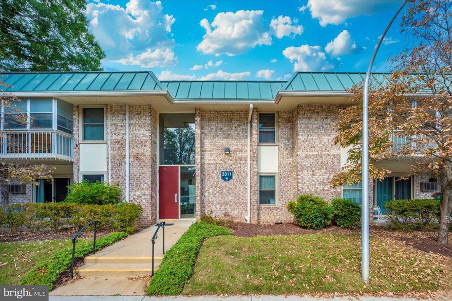 Discover a 55+ community where resort-style living, peace of mind, and vibrant connections come together—welcome to Leisure World of Maryland! This well-cared for Montgomery Mutual Blair model offers low-maintenance living in Leisure World. One flight up, this 1BR/1BA co-op is freshly painted and carpeted with new outlet covers, fresh caulk, and brushed-nickel hardware. The sunroom/balcony adds flexible space for plants, reading, or hobbies. Storage is a plus with multiple closets and an assigned storage cage; laundry is on the same floor (shared by four units). One parking space will be assigned at settlement. The $945/month co-op fee covers ALL UTILITIES AND PROPERTY TAXES, basic cable and internet, reserves, and access to community amenities—clubhouses, pools, fitness, dining, pickleball/tennis, art studio,  wood shop, trips, transportation, and events. Golf membership available!
Two one-time fees will be charged to the buyer at settlement: a $500 membership transfer fee for coops plus 3% of the gross sales price (or $2,000, whichever is greater) to the resale improvement fund. The perfect right-size for you!