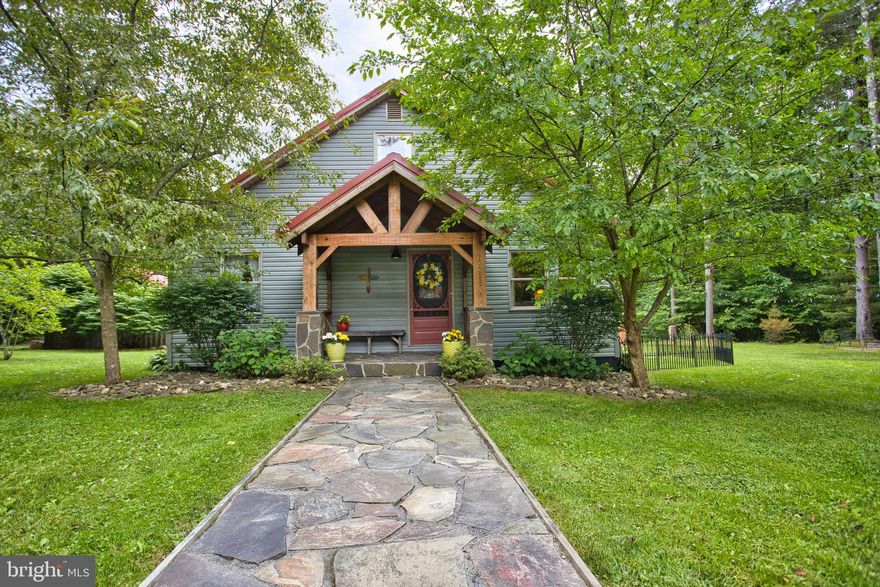 SPECTACULAR COTTAGE/CABIN-THREE BEDROOM HOME BOASTS OVER 2 ACRES OF LEVEL PARK-LIKE GROUNDS! ALSO Great Rental Potential included with this sale. Spacious Above Garage 2 Bd Apartment that is Meticulously kept. This visually striking residence is perfect for both entertaining on a grand scale and more intimate family gatherings. The craftsmanship and impeccable finishes you will see all through this home.  This enchanting cabin/cottage is ideal for those seeking a serene, storybook home filled with character & charm!  Enjoy the sunlit kitchen with modern amenities seamlessly blended with rustic charm which includes SS high end appliances, (dual ovens) Both the home and the apartment have stunning crafted walk-in showers with porcelain tiles and high end bath fixtures; and the amenities go on and on. This 30x40 finished garage is a spacious & versatile addition, perfect for a variety of uses. Inside the garage has heated floors and fully insulated walls, ample overhead lighting along with a stunning finished area with tongue-groove pine walls and a sheet metal ceiling. The first bay offers a well designed half bath. Gather around the beautiful fire-pit nestled in the woods that  offers a perfect retreat for relaxation and social gatherings. Nearby, a stack of neatly arranged firewood is ready for use, adding to the rustic charm. The surrounding woods provide a serene backdrop, with tall trees offering a canopy of greenery and the sounds of nature creating  a PEACEFUL  AMBIANCE,  Grow your own vegetables in  the spacious garden area  that has been thoughtfully planned & maintained. Also included is a charming outbuilding that serves as a practical storage area for all your lake toys but also adds to the idyllic, rustic feel of your cottage retreat. Located within minutes to DCL Amenities, several Sate Parks, the Wisp Ski Resort and more. All this is WAITING  FOR YOU! Make the call to set up a private showing of this Spectacular Property...