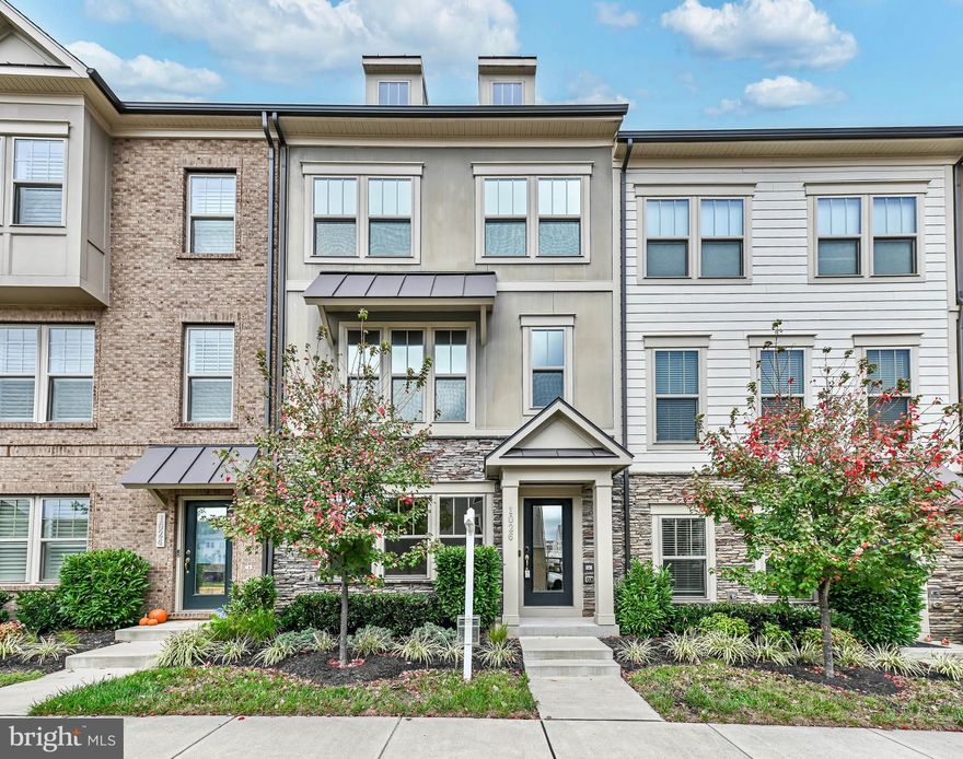 Location, Location, Location! Built in 2020 beautiful four-level home. The entry level offers a convenient half bath and a versatile flex space—ideal for a home office or gym—with direct access to the oversized two-car garage. The main level is an open-concept layout with luxury vinyl plank flooring and natural light throughout. The gourmet kitchen is a chef's dream, featuring a large sit-down island with sleek quartz countertops, modern 42” upgraded cabinetry, and stainless-steel appliances. This space flows seamlessly into a cozy family room with a built-in fireplace and a formal dining area that leads to a deck, perfect for outdoor relaxation. The third level is home to a spacious primary suite with a tray ceiling, a private en-suite bath, and a walk-in closet. There are two additional bedrooms and a conveniently located laundry room. The top floor offers a spacious loft area, perfect for a secondary lounge or hobby room, that opens onto a private rooftop terrace with breathtaking views of Tuscarora Village. This home is perfectly situated in the vibrant Tuscarora Village community, where you’ll enjoy a tot lot, community pool, clubhouse, and pickleball courts and access to the W&OD trail. The location is just minutes from downtown Leesburg, the Leesburg Outlets, and the Village at Leesburg, you'll have easy access to shopping, dining, and outdoor parks and 20 minutes from Dulles International airport. Available for immediate occupancy. Application through RentSpree and NVAR form