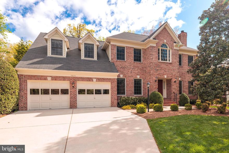 Welcome to 5801 Westchester Street, a magnificent 6 bedroom and 5 full-bath custom brick-front colonial by highly respected Morris Construction backing to trees and sited on a third of an acre lot in Alexandria’s popular Bush Hill Woods. Professional landscaping and curved planting beds tastefully frame the home and provide great curb appeal. A slate walkway, brick steps and stoop and covered front entrance provide a classy welcome. The impressive 2-story foyer has a large Palladian window with sidelights, ceiling medallion and a plant shelf. There are classic sand-in-place solid oak hardwood floors on the main and upper levels. Extensive upgraded moldings adorn the main and upper levels too. Working from home is a breeze with the main level office, with its built-in shelves and cabinets. It could easily serve as a main-level bedroom too as there’s a full bath down the hall. Custom built-in bookcases flank the inviting gas fireplace with its granite surround and wood mantel in the family room. The formal living room has elegant chair-rail, crown and box moldings and the second fireplace with a marble surround and detailed wood mantel. There’s a bay window in the eat-in kitchen along with rich solid cherry cabinets with under-cabinet lighting, white tile backsplash, granite counters and stainless appliances that were new in 2021. The microwave is brand-new. Off the kitchen, glass-panelled doors lead to the cheerful sunroom with walls of windows with transoms above and a high ceiling. Step out from the sunroom to the huge deck overlooking trees - the perfect spot for grilling, relaxing or entertaining. Steps descend to the private and beautifully landscaped and maintained rear grounds. Upstairs, there are 4 spacious bedrooms - all with ceiling fans - and 3 full baths. The stunning owner’s suite has a sitting room the size of a bedroom, two walk-in closets, two dormer windows with window seats, vaulted ceilings and lots of extra storage in the eaves. You’ll see a jetted deep-soaking tub in the owner’s bath along with two vanities with quartz countertops, seamless glass shower doors, nice tilework and recessed and dimmable lighting. The expansive lower level features two large bedrooms - one with 4 windows - a full bath, two storage rooms plus a separate finished storage/office room and the tremendous rec room with lots of windows and lights. Step out from there to the excellent wrap-around patio. Keep your vehicles pristine in the oversized garage, which has a window and door to the side yard. This fine home is tucked away on a quiet street, yet close to everything - within 10 minutes of three Metro stops, all commuter routes, shopping, restaurants and just a quick hop to Old Town Alexandria!
