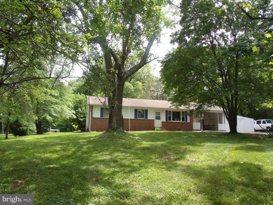 SECLUDED RANCHER OFFERS 3 BEDROOMS, 2 1/2 BATHS, HARDWOOD FLOORS THRU-OUT, CERAMIC BATH AND KITCHEN, ALL FRESHLY PAINTED AND UPDATED.  ON 1.92 ACRES IS PRIVATE ( OFF OF MAIN ROAD).  BASEMENT W/KITCHEN, FULL BATH, LARGE REC ROOM, XTRA ROOM, AND WALK IN  CLOSET. GREAT FOR ENTERTAINING OR POSSIBLE IN LAW SUITE.  ALSO ATTACHED CARPORT. PRICED TO SELL!