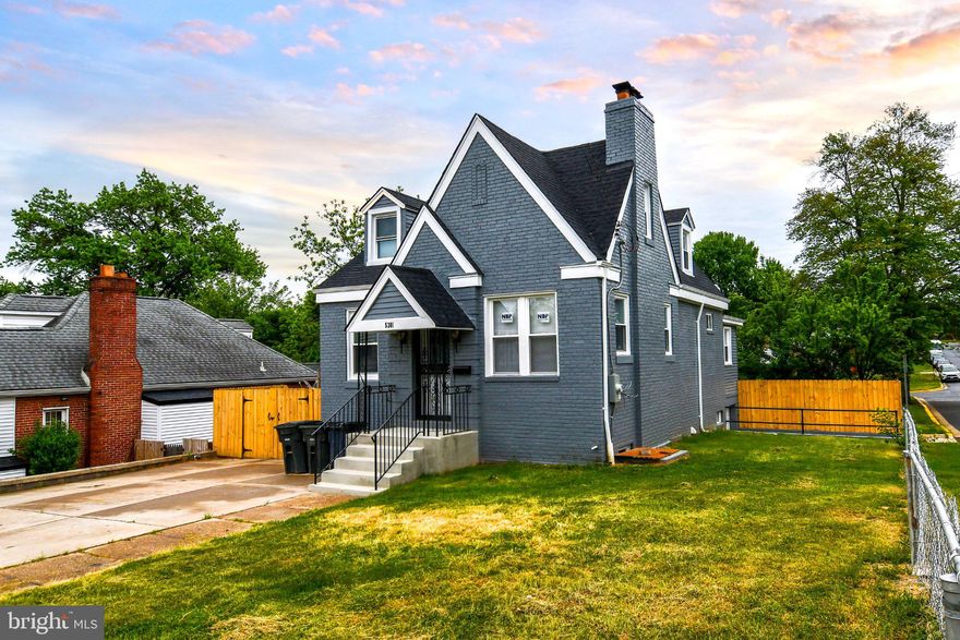 Nestled in the charming Bladensburg neighborhood, this beautifully renovated Cape Cod home offers a perfect blend of classic elegance and modern comfort. With a major renovation completed in 2026, this residence is designed to meet the needs of today's discerning homeowner while retaining its timeless appeal. Step inside to discover a warm and inviting atmosphere, highlighted by new floors that flow seamlessly throughout the main living areas. The spacious entry-level bedroom provides convenience and flexibility, making it an ideal space for guests or a home office. The heart of the home is the eat-in kitchen, featuring ample table space for casual dining and gatherings. Equipped with modern appliances, including a dishwasher, microwave, and electric oven/range, this kitchen is both functional and stylish. The living area is enhanced by a cozy fireplace with glass doors, perfect for creating a welcoming ambiance during cooler months. Large bay windows invite natural light, creating a bright and airy feel throughout the home. With a total of five bedrooms and three full bathrooms, there is plenty of room for everyone to enjoy their own space. The partially finished walkout basement offers additional living space, ideal for a playroom, media room, or personal gym. The outdoor space is equally inviting, featuring an enclosed porch that extends your living area outdoors, perfect for morning coffee or evening relaxation. The corner lot provides a sense of privacy and space, while the attached garage and paved driveway ensure convenient parking. This home is not just a place to live; it's a sanctuary where memories are made. The combination of thoughtful renovations, functional layout, and desirable features makes this property a true gem. Whether you're entertaining friends or enjoying a quiet evening at home, this residence is designed to cater to your lifestyle. Don't miss the opportunity to make this charming Cape Cod your own. Experience the comfort and warmth that this home has to offer, and envision the life you can create within its walls.