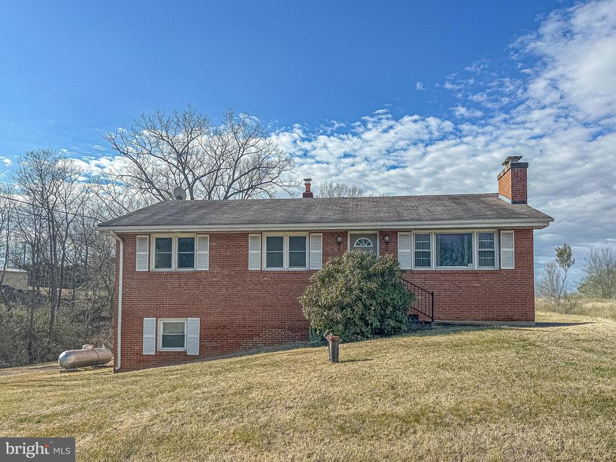 Welcome home to this spacious rancher offering true main-level living on a flat half-acre lot with NO HOA, tucked away on a quiet, low-traffic street in a highly convenient location between Front Royal and Strasburg. Inside, you’ll love the huge kitchen and dining room combo, perfect for gatherings, and the immense living room with a cozy fireplace that creates a warm, inviting atmosphere. Hardwood floors are under the carpet in the upstairs bedrooms. The almost fully finished basement features a bedroom and half bath, plus two large bonus rooms, including one equipped with surround sound—ideal for entertaining or a home theater setup. Step outside to the large patio just off the kitchen entrance, perfect for BBQs, outdoor dining, and relaxing evenings. Furnace/AC replaced in 2023, hot water heater replaced in 2023, septic pumped in 2025 and new riser lid, well pump replaced @7 years ago. With generous space, flexible living areas, and an unbeatable combination of privacy and convenience, this home truly has it all.