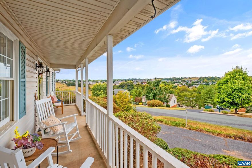 Seeking a retreat in the heart of the sought-after Wyndham Hills community with NO HOA? Picture yourself stepping inside to be greeted by the warm embrace of hardwood floors, lofty ceilings, and a crackling wood-burning fireplace nestled with a built-in bookshelf. Spacious 3-bedroom layout, ample space for you to unwind and create memories. Full unfinished basement offers endless possibilities for expansion or stashing away your treasures. Oversized 2-car garage comes with a level-2 TESLA charger! Escape to the inviting front porch and bask in the serene beauty of breathtaking valley views, providing the ultimate backdrop for moments of relaxation and reflection. Or hide away on your back deck while grilling & enjoying the views!  Own your piece of tranquility in one of the most coveted neighborhoods around!,Formica Counter,Oak Cabinets