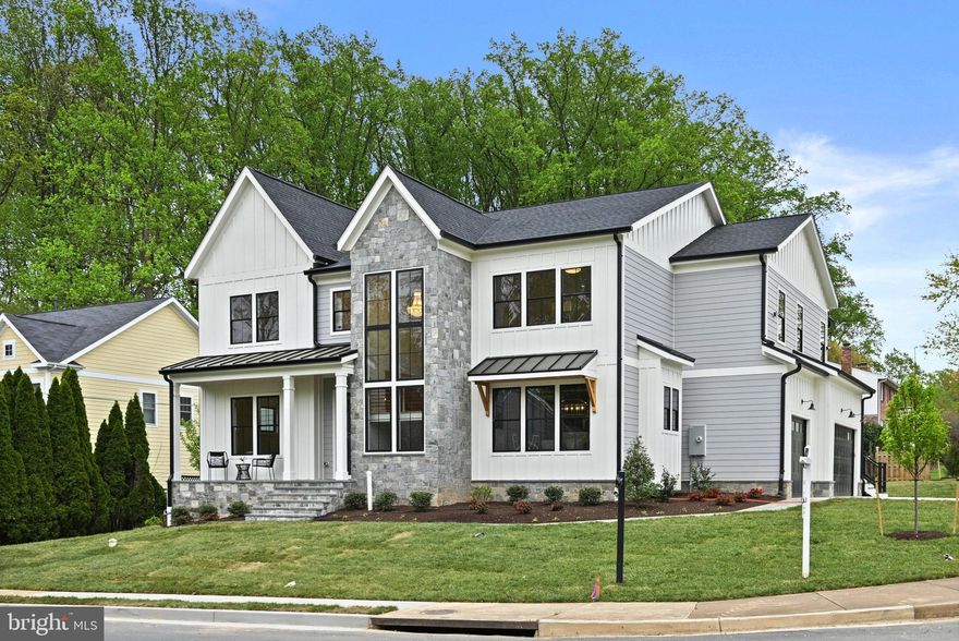 **Price Improvement**Welcome to Vienna Development Alliance's latest offering, a rare combination of an idyllic location, expansive space (including five upper level bedrooms), and an ultra high-end spec level.  Situated on a quiet cul de sac with a side-load three car garage, this Modern Farmhouse will dazzle with its dramatic front staircase clad with natural stone veneer on the exterior and flanked by a wall of windows.  The kitchen features a full Wolf/Sub-Zero appliance package, stacked shaker cabinets with custom hood, quartz countertops with matching backsplash, a cast iron Kohler farmhouse sink, and a massive 10' island.  The entire main and upper levels (excluding tile areas) are covered with 5" wide white oak floors exquisitely finished on site with water-based top coats.  Off the expansive family room is a fully outfitted screened deck, which includes a gas fireplace, as well as an open deck with grilling area.  The oversized mudroom has its own entrance just off the driveway and includes a highly functional custom built-in storage center.  Shiplap accents, ceiling effects, wainscoting detail, and elaborate built-ins are sprinkled throughout the house.  Upstairs, the four secondary bedrooms all include en-suite bathrooms and the laundry/craft room is overloaded with cabinetry and counter space.  The master suite is a true oasis with a sun-filled sitting area perched above the backyard, oversized sleeping quarters, fully built-in walk-in closets, one of which includes a center island, and a spa-like master bath.  The basement offers plenty of space to stretch out with a luxurious feel provided by the LVP flooring over a fully leveled slab.  Enjoy movies and the big games in the massive rec room with a full wet bar and game area.  A bedroom, full bath, media room, and exercise room round out the lower level.  All this in a fantastic NE location that's a half mile walk to the highly rated Wolftrap Elementary as well as Historic Church Street.  Don't miss out!