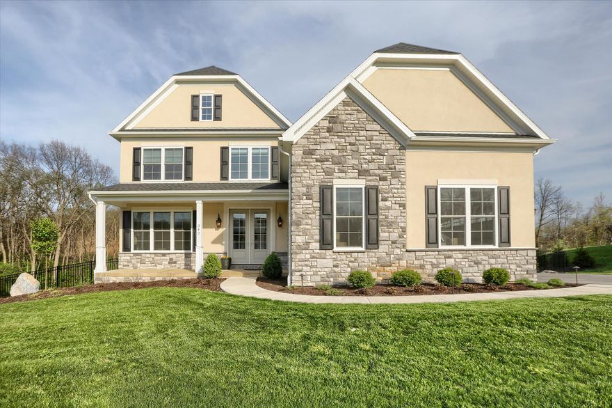 Set within the exclusive Pennington community, this exceptional estate home offers refined living across 38 rolling acres with just 38 residences, a single picturesque street, and over a mile of private walking trails that connect to the Winding Hill Community trail network, offering a total of five miles of scenic paths for walking, jogging, and outdoor enjoyment. This distinguished neighborhood is defined by its elegant streetscape, where all homes feature masonry front elevations—setting a consistent tone of prestige and estate-style living. With the community nearing completion, this is a rare opportunity to enjoy a peaceful, established setting without ongoing construction.
Only two years young, this residence showcases over $160,000 in thoughtfully selected, high-end upgrades that elevate the already impressive builder design. A spacious front porch creates a warm and inviting first impression, while the exterior is further enhanced by nearly $60,000 in custom hardscaping and landscaping by GoldGlo, along with a $19,000 fenced backyard—offering a private outdoor retreat. Inside, the home is equally impressive, featuring $37,000 in Hunter Douglas custom window treatments, over $30,000 in bespoke built-ins and custom shelving, and curated art lighting throughout.
Designed with both elegance and functionality in mind, the home features luxury LVP flooring, extensive crown molding, rounded corners and a bright two-story grand foyer with chair rail detailing. The open-concept floor plan is anchored by a stunning, chef-inspired kitchen, complete with an oversized island, slab granite countertops, Bosch appliances including a six-burner stove, farmhouse sink, under-cabinet lighting, and an expansive walk-in pantry—ideal for everyday living and entertaining alike. Thoughtful craftsmanship continues throughout with soft-close cabinetry featured across the entire home. A versatile first-floor den offers a multitasking space, perfect as a bedroom, home office, or hobby room.
The primary suite serves as a private retreat, offering a spa-inspired bath with Taj Mahal granite countertops, a soaking tub, and a beautifully tiled shower. A thoughtfully reimagined fourth bedroom functions as a custom dressing room with its own private bath, while two additional bedrooms offer walk-in closets and are connected by a Jack and Jill bath featuring Taj Mahal granite counters.
Additional highlights include a well-appointed mudroom, a three-car garage equipped with a UV wall charger, custom shelving, and a convenient mop sink, and a walkout lower level with future potential. Exceptional outdoor living spaces feature a large patio and composite deck—perfect for summer enjoyment.
Ideally located just minutes to McCormick Park, Simpson Park, and Messiah University, where the lure of Yellow Breeches Creek offers some of North America’s most prized fishing and game, kayaking, and tubing. Also just a short drive to Harrisburg, Hershey, and Gettysburg, this home offers an exceptional blend of luxury, location, and lifestyle.