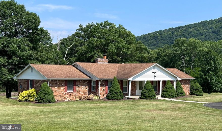 IMMACULATE 3 BEDROOM, 2 BATH TOTAL BRICK RANCHER ON LANDSCAPED ON 4 ACRE CORNER LOT IN GREAT OAK VALLEY SUBDIVISON.  FULLY REMODELED EAT-IN KITCHEN (2007) WITH ALL “KITCHEN AID SUBPERBA” APPLIANCES, CEILING FAN/LIGHT AND WOOD LOOK FLOORING. UTILITY ROOM W STACKABLE WASHER/DRYER INCLUDED. HUGE FAMILY ROOM W BRICK FIREPLACE (2 WOOD BINS), WOOD PANEL WALLS, CEILING FAN/LIGHT AND COMMERICAL CARPET.   SPACIOUS LIVING ROOM OFFERS  BRICK FIREPLACE W MANTLE, CUSTOM BLINDS THRU-OUT AND TEXTURED CARPET.  CUSTOM BUILT FLORIDA (SUN ROOM) WITH 3” KNOTTY PINE T&G WALLS, 5” T&G CEILINGS, COMMERICAL CARPETING & 7 GLASS SLIDING GLASS DOORS.  MASTER SUITE WITH AMPLE CLOSET SPACE, CEILING FAN/LIGHT, PLUSH TEXTURED CARPETING AND PRIVATE UPGRADED BATH W SIT DOWN SHOWER UNIT.  2 GUEST BEDROOMS W CARPETING AND GENEROUS CLOSETS.  FULL BATH W TUB-SHOWER COMBO & LINOLEUM FLOORING.  OTHER AMENITIES: FRONT AND REAR COVERED PORCHES.  ATTACHED (2-CAR) GARAGE, 100% METAL DETACHED GARAGE,  COY-STOCKED POND, SHOWCASE CIRCULAR PAVED DRIVEWAY W FLAGPOLE CENTER PIECE. BE THE FIRST PROUD OWNER OF THIS UNIQUE COUNTRY HOME.  LOW WV TAXES!  MOUNTAIN VISTAS AND BEAUTIFUL SUNSETS INCLUDED FREE!!!!