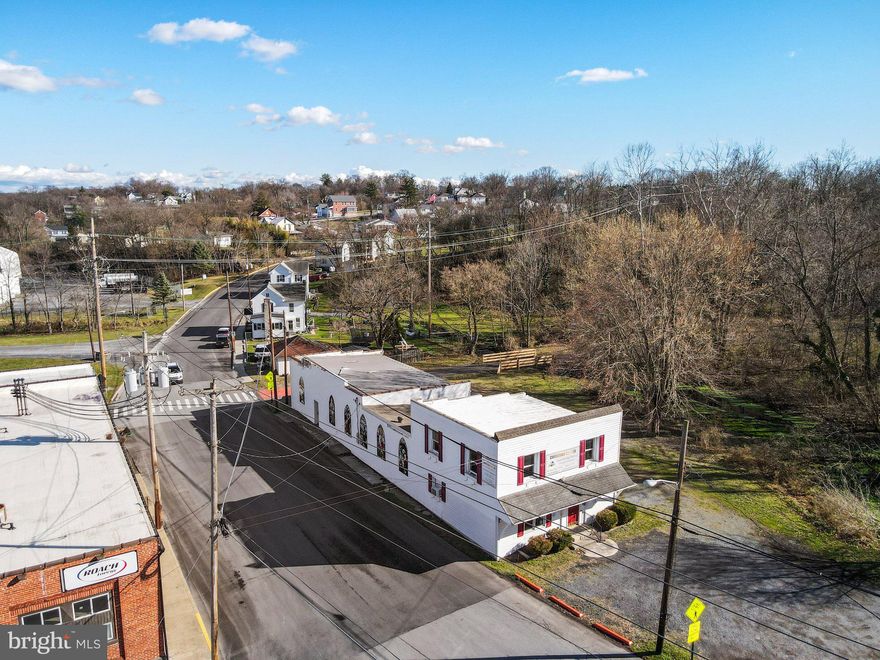 Commercial Building in the Heart of Downtown Martinsburg, within walking distance to Downtown Shopping, County Courthouse, Sheriffs Department and many County and City Buildings. Has operated as a church for many years but could be utilized for many different uses. Building Consists of Large Chapel area, two classrooms, two bathrooms, a kitchen, Large room at main entrance, and two large rooms on the upper level.
